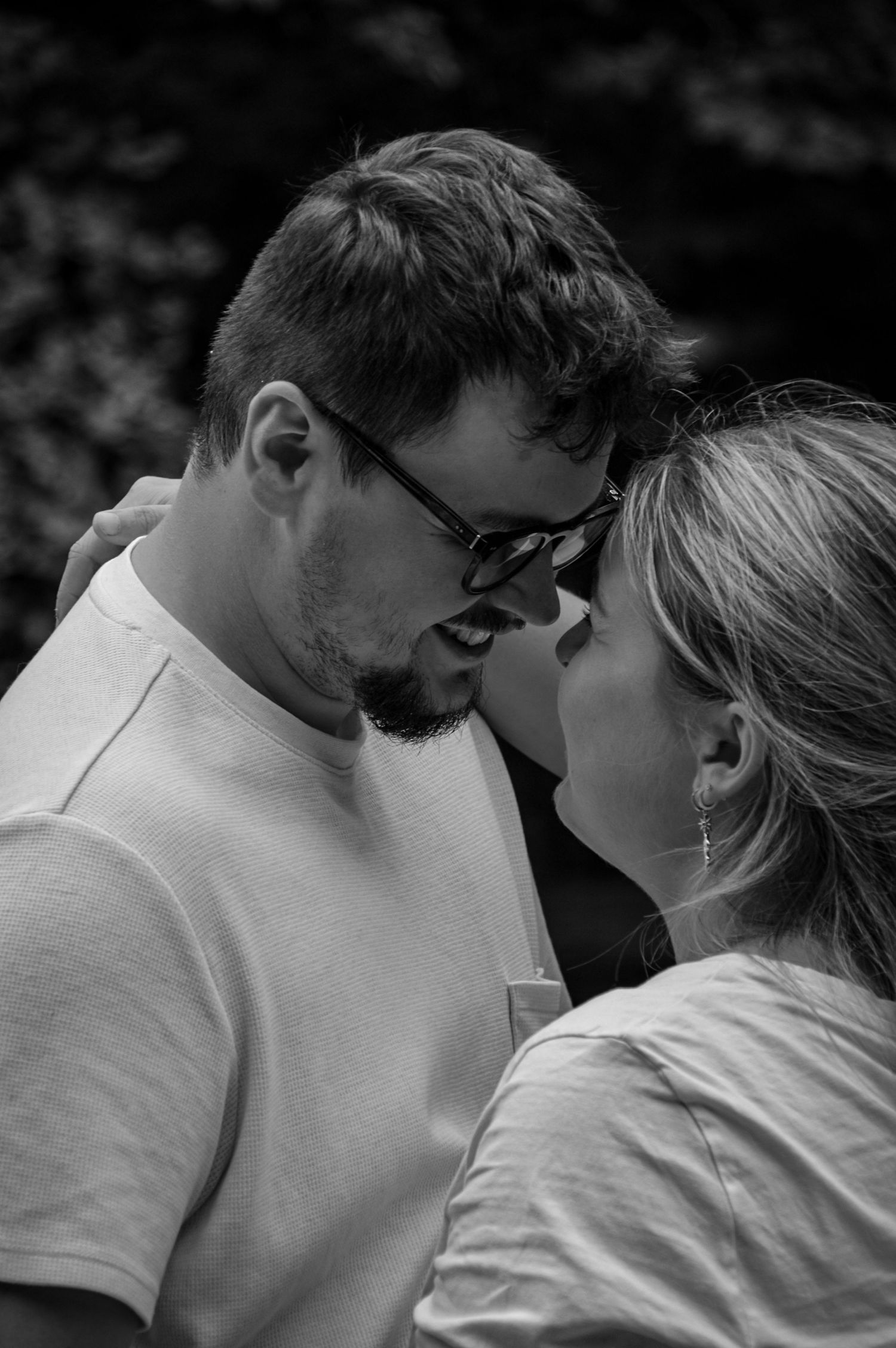 Black and white romantic sequence showing a couple in an intimate moment.