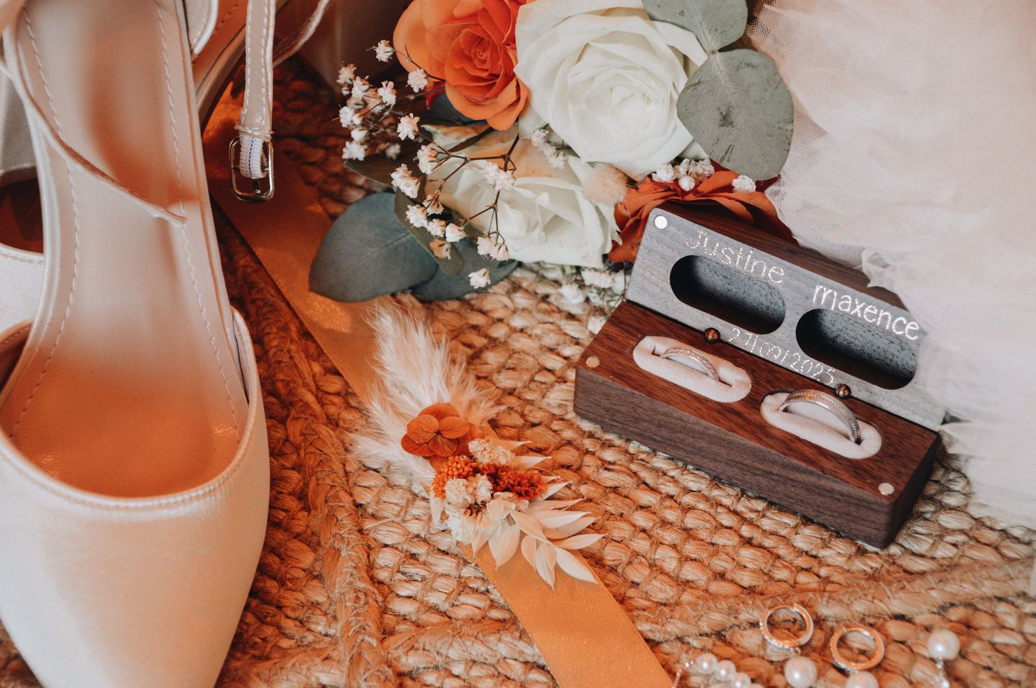 Wedding detail shots featuring orange and white floral arrangements and bridal accessories.