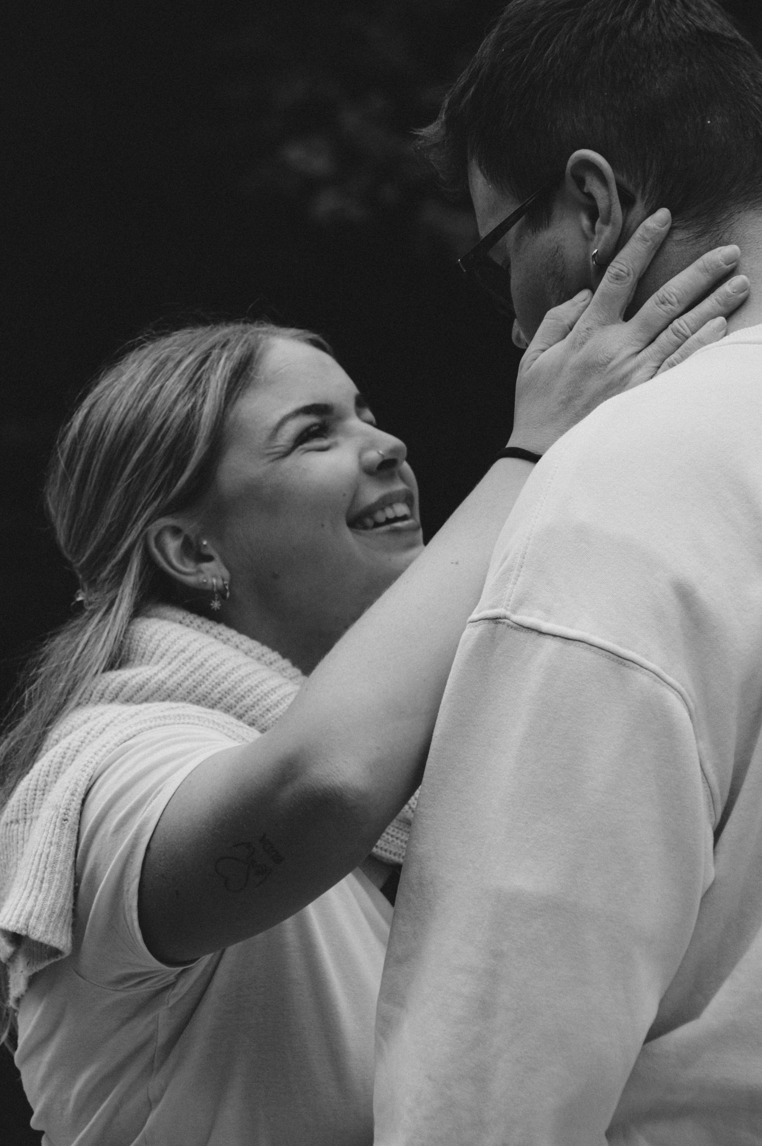 Black and white sequence showing tender romantic moment between couple outdoors.