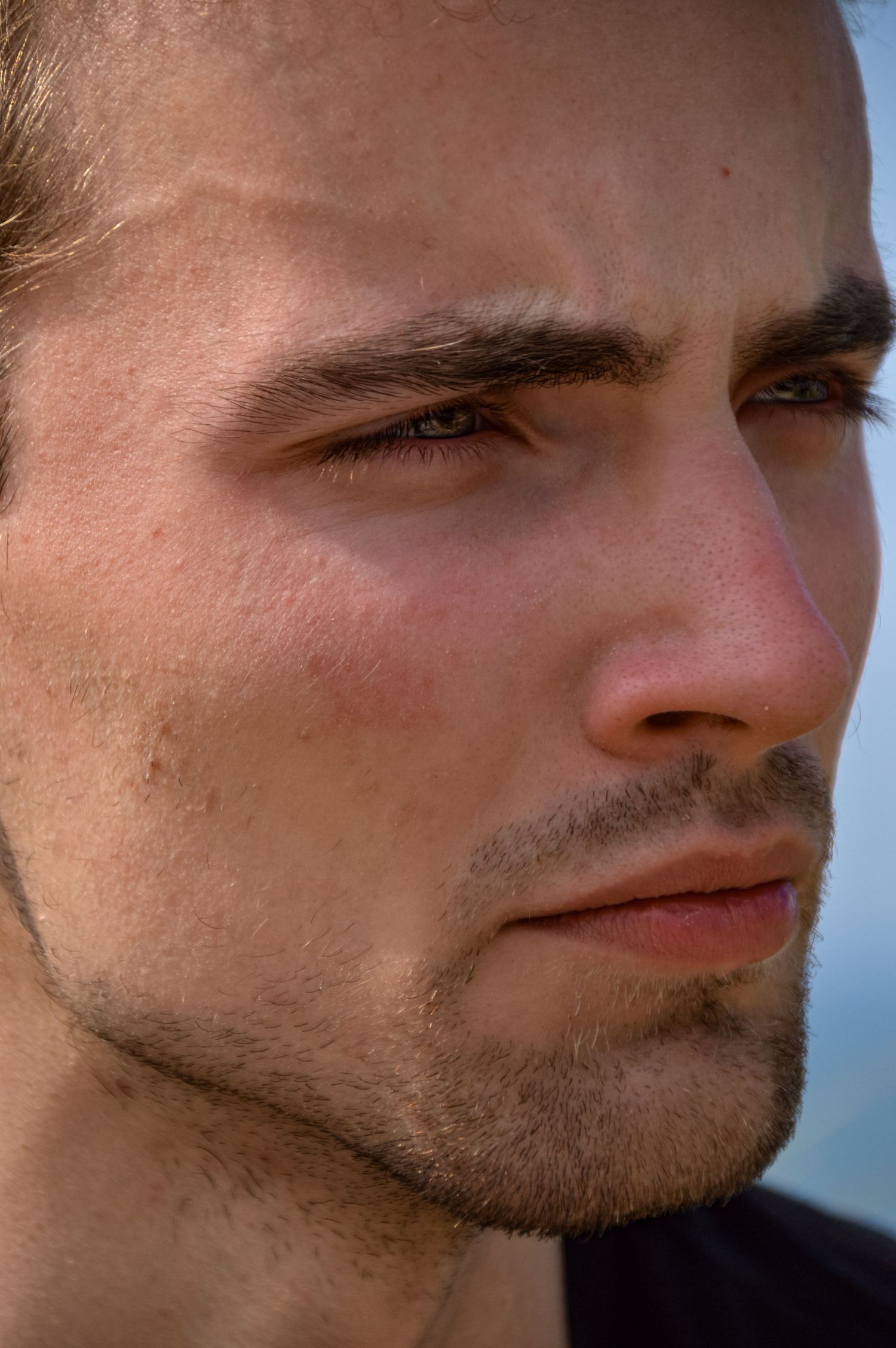 Close-up profile shots showing facial features in natural lighting.