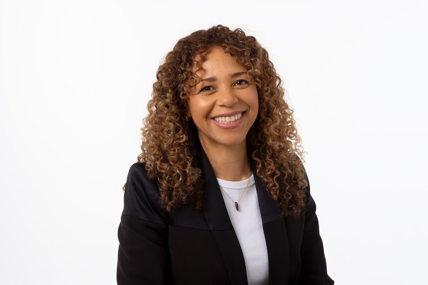Classic female headshot on a high key white background.