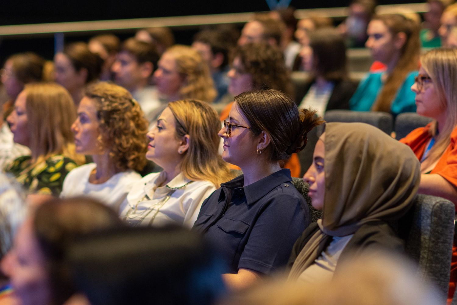 Women sitting in the audience of a theatre.