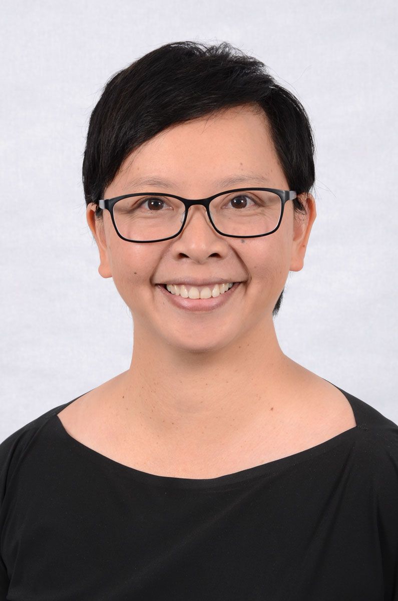 Vietnamese Australian photographer Hang Le headshot on white background.