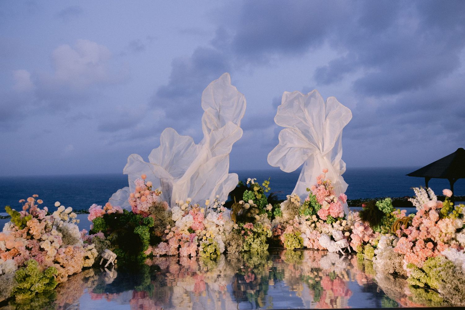 Elegant Bali wedding reception details with tropical floral décor