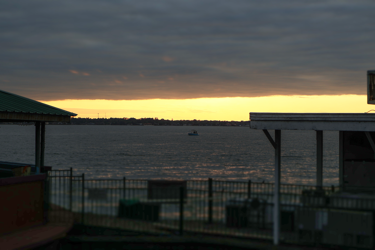 A boat on a lake during sunset