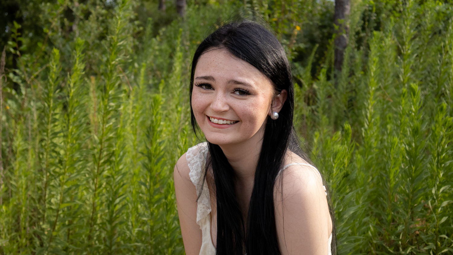 Girl laughing in field