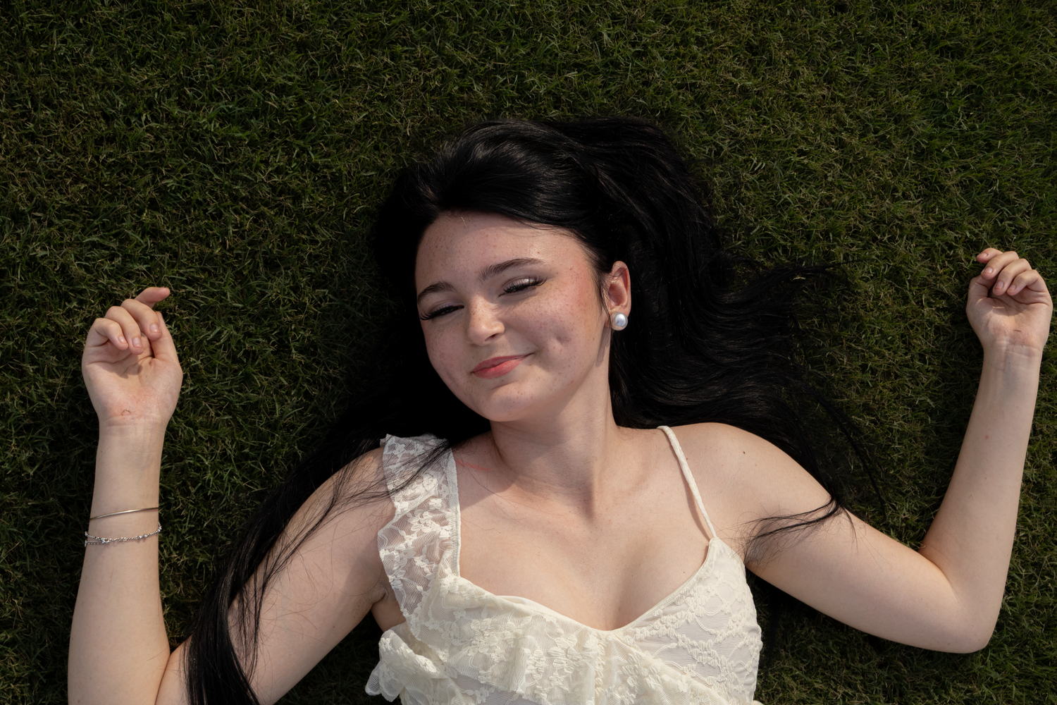 Girl laying in grass