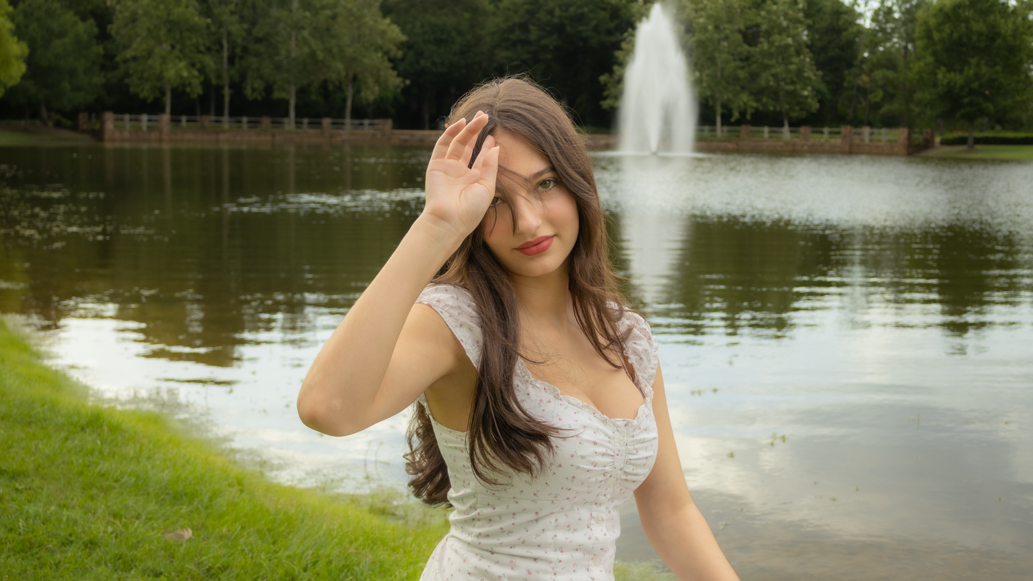 Girl standing in front of a fountain