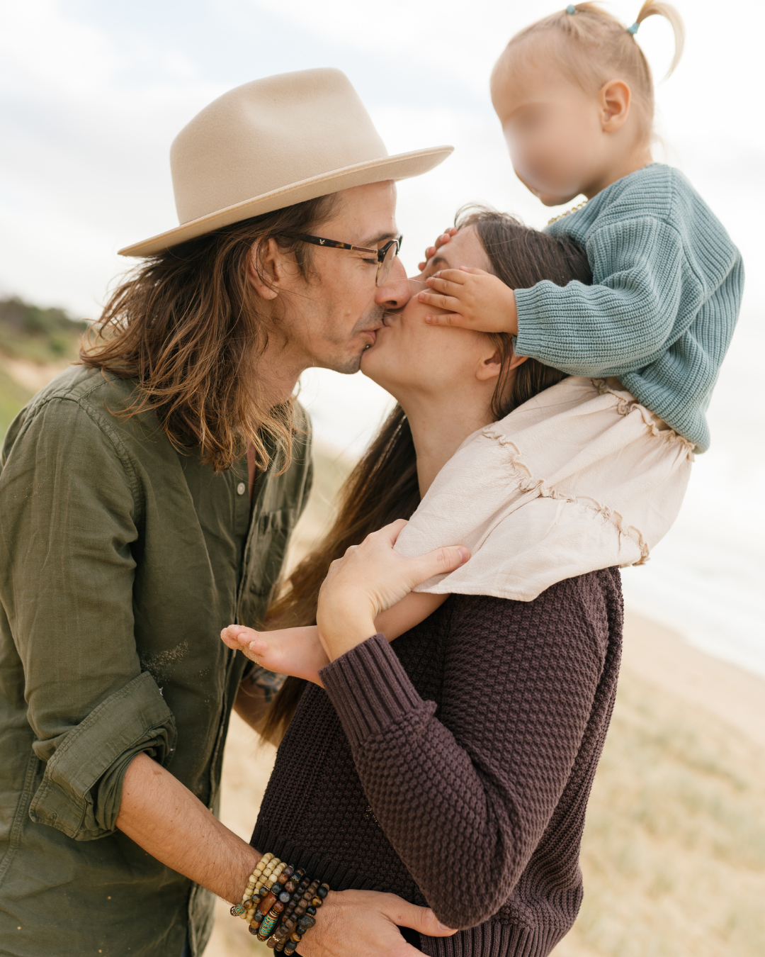 Relaxed family portraits captured at Warana Beach during golden hour