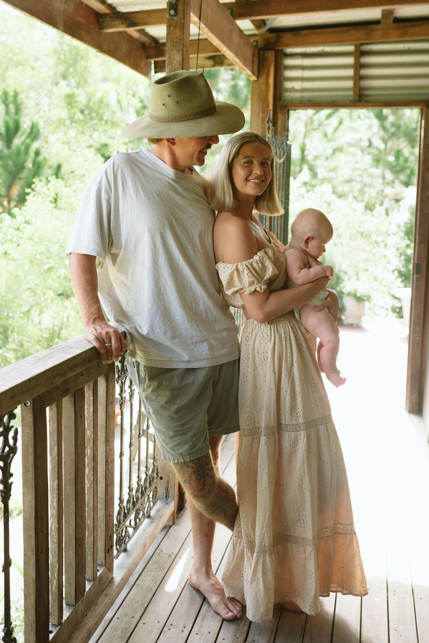 Family of three enjoying a relaxing morning at home during a family photography session