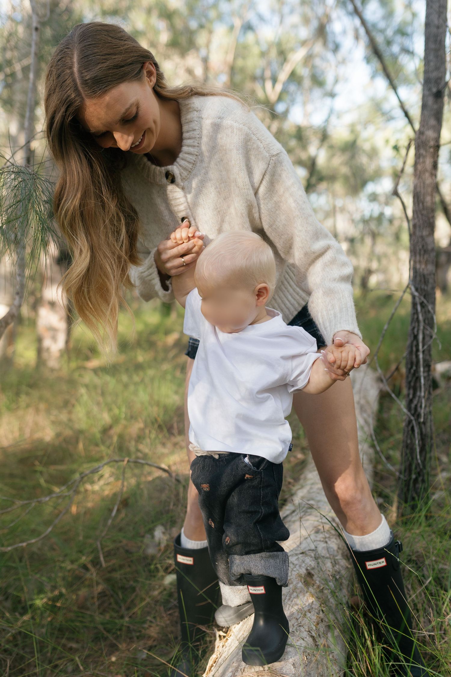 Mum and child sharing a playful moment together outdoors