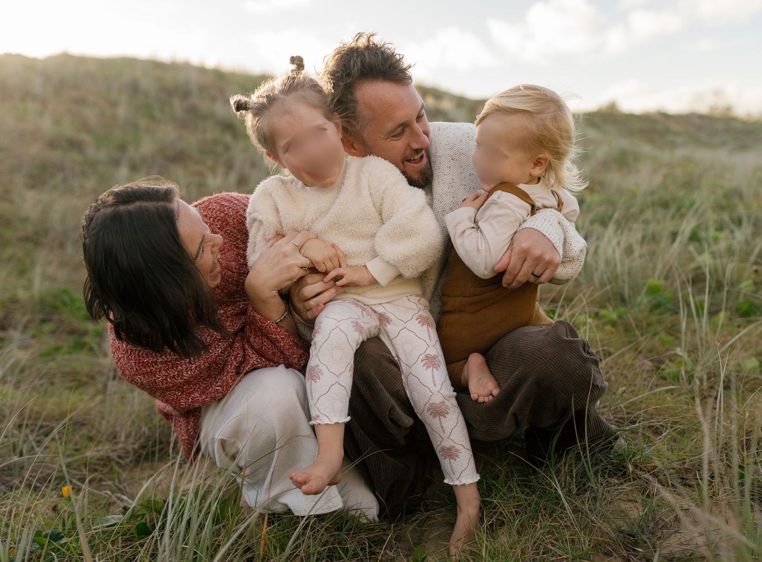 Authentic connection between parent and children during a relaxed warana beach family photography session
