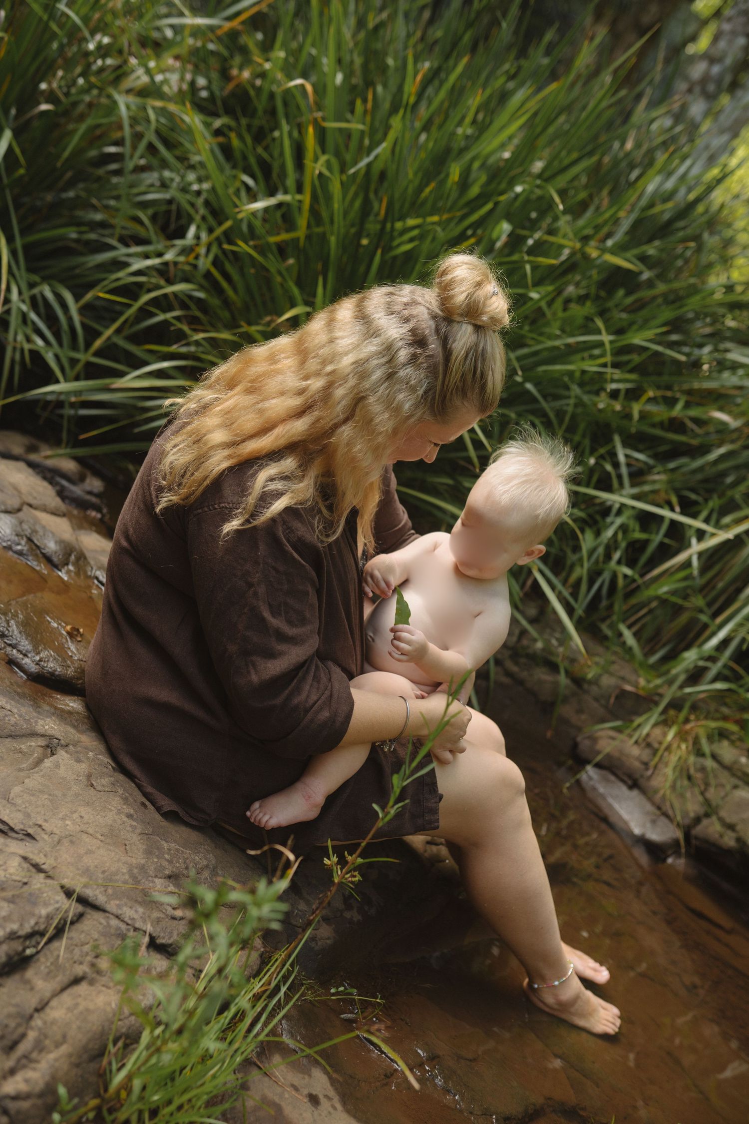 Mum and child sharing a playful moment together outdoors