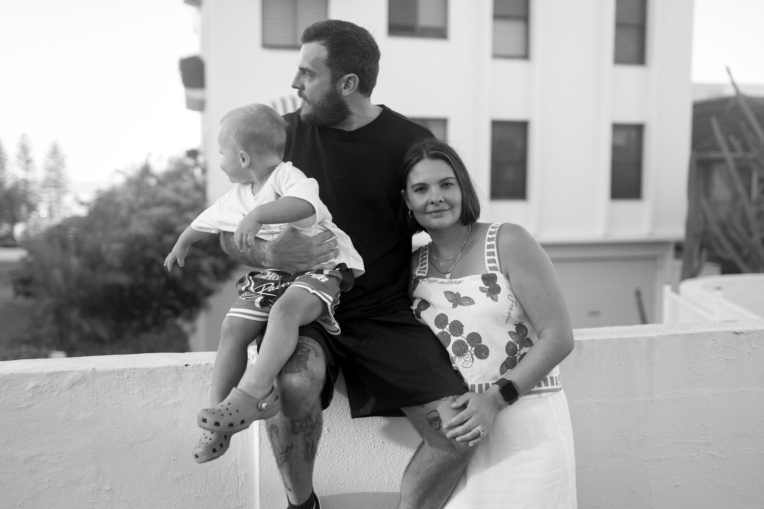 Family playing together outdoors during a natural lifestyle photo session