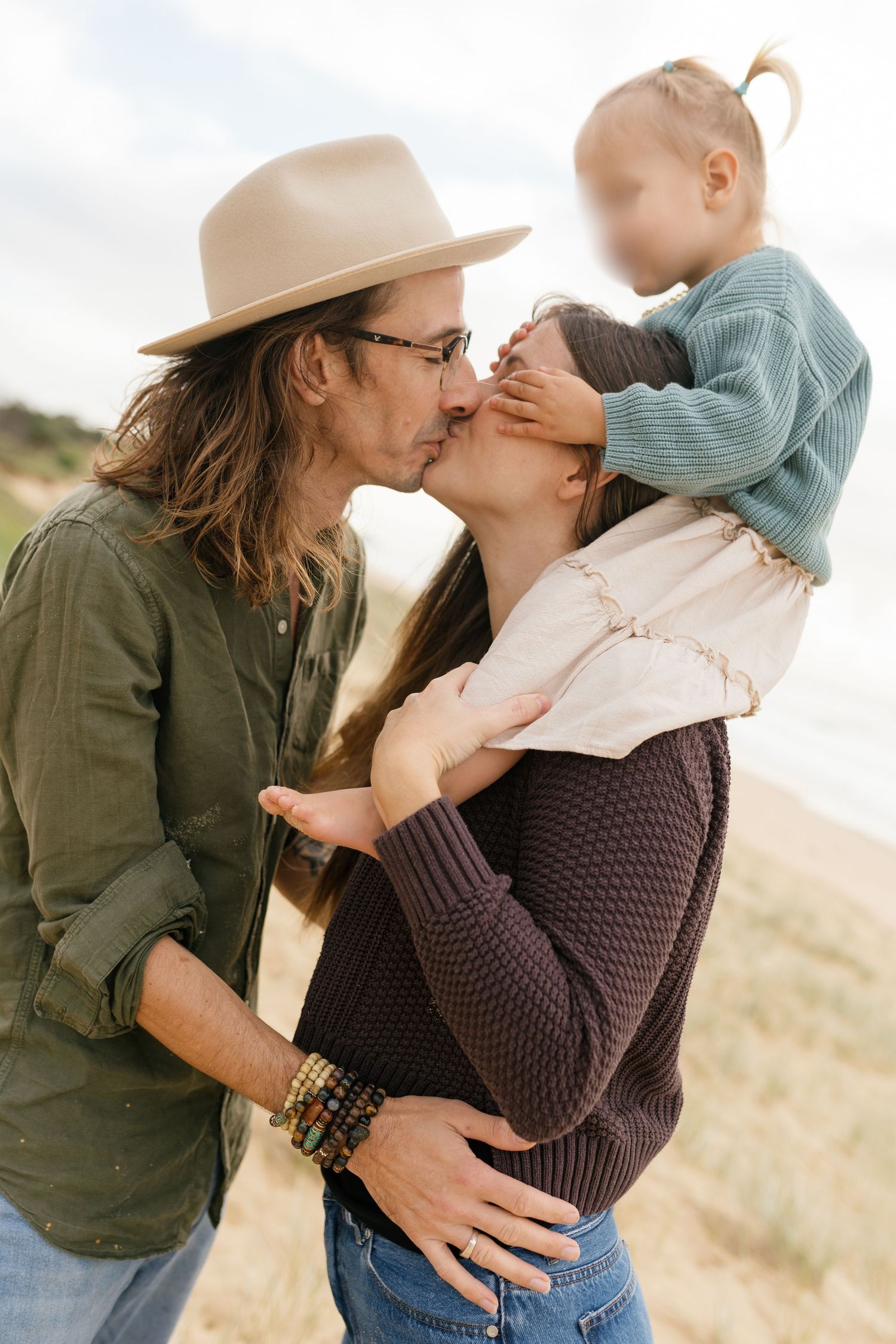 Relaxed family portraits captured at Warana Beach during golden hour