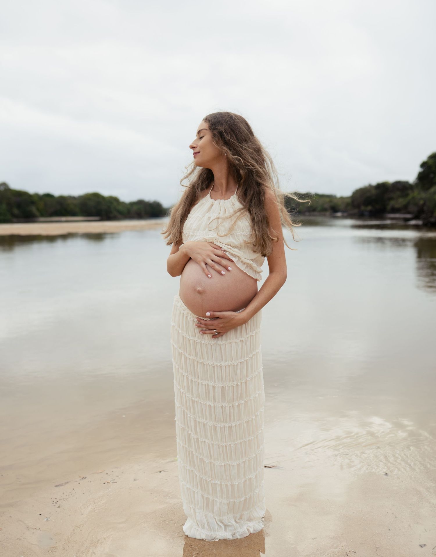 Mother-to-be captured naturally during a timeless maternity photography session