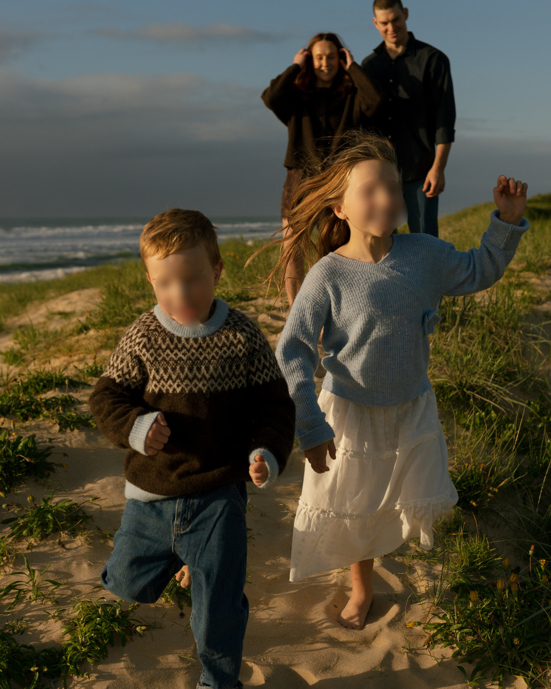 family walking together along Warana Beach during a mini photography session