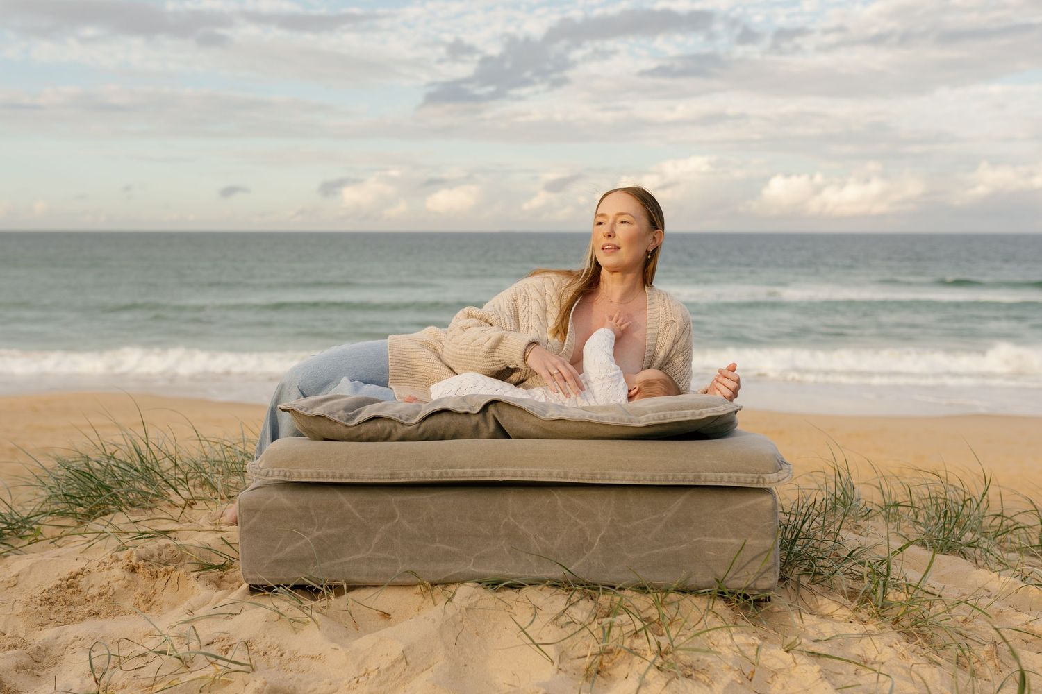 Tender mother and baby connection captured during a relaxed coastal photography session