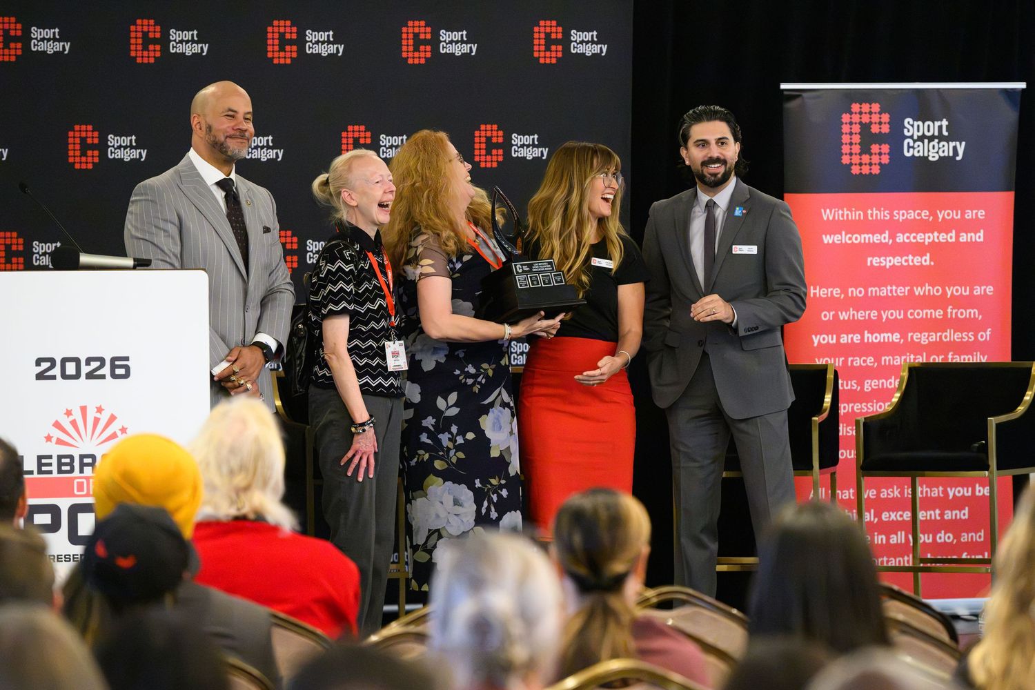 Award ceremony at Sport Calgary 2026 celebration event with presenters on stage.
