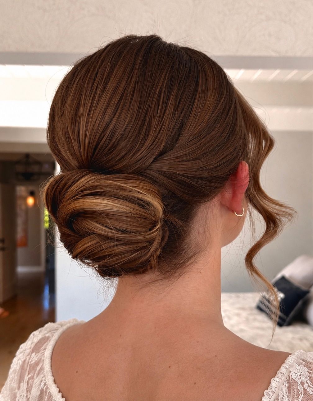 Bridal hairstyle sleek modern elevated low bun