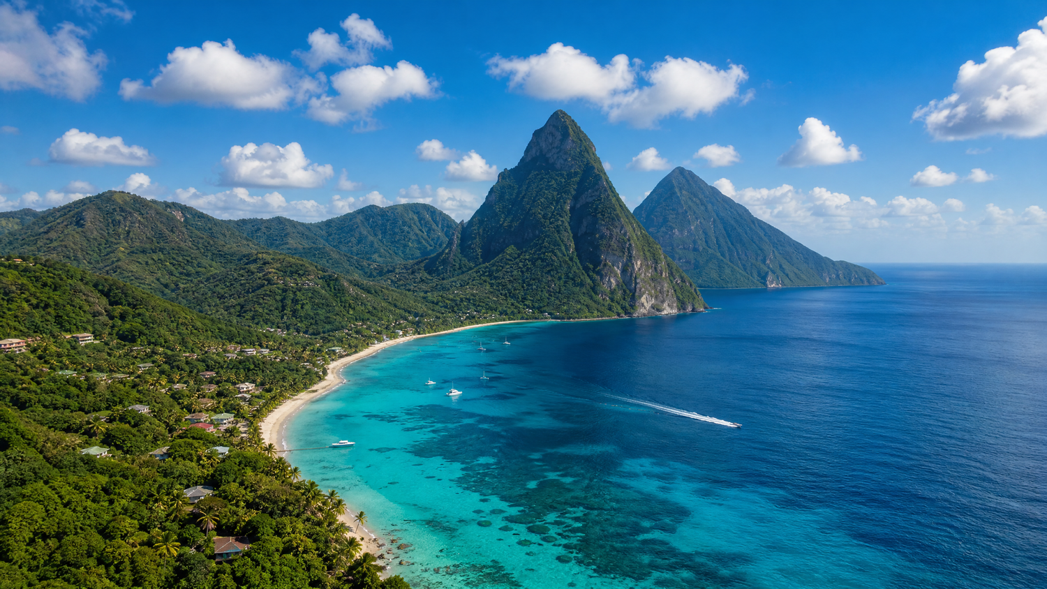 Aerial view of St. Lucia's iconic twin Piton peaks overlooking a pristine turquoise Caribbean bay.