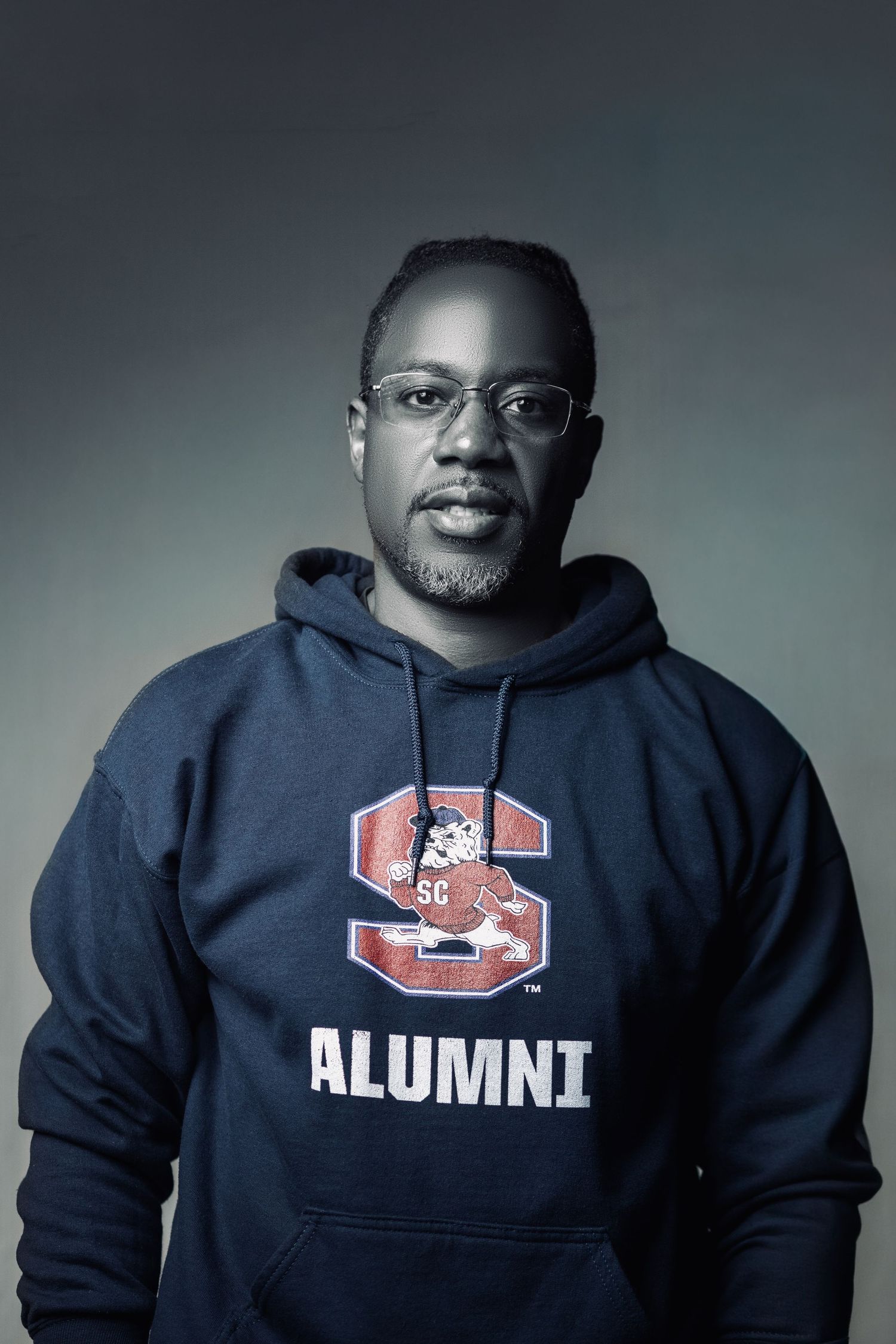 Portrait of a photographer wearing a South Carolina alumni sweatshirt