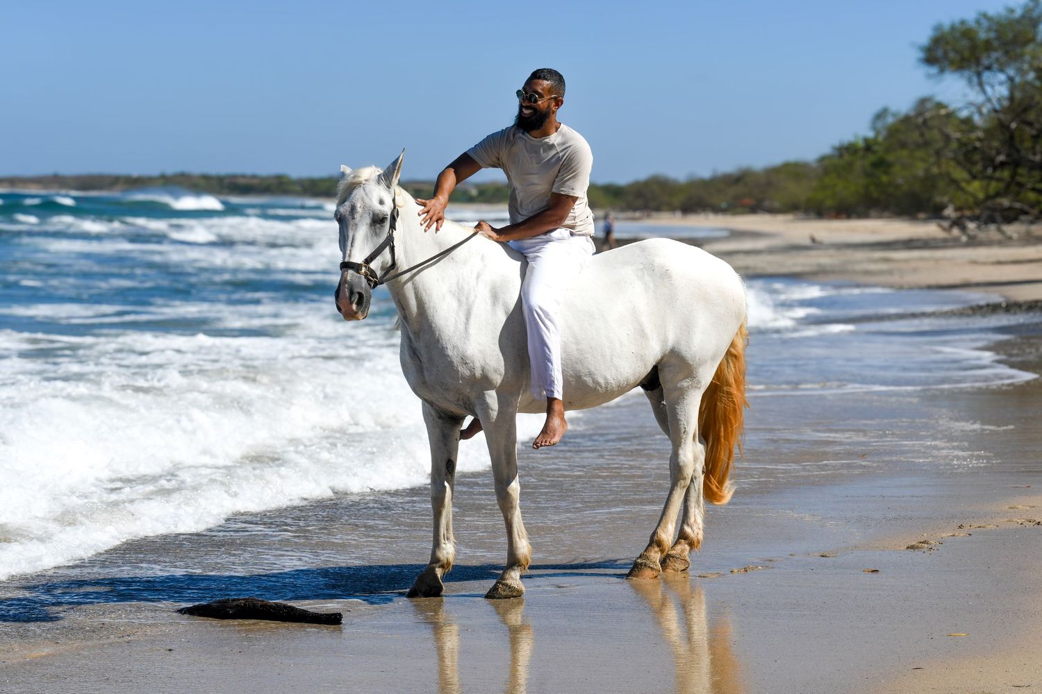 Horseback ride along the beach at Playa Avellanas