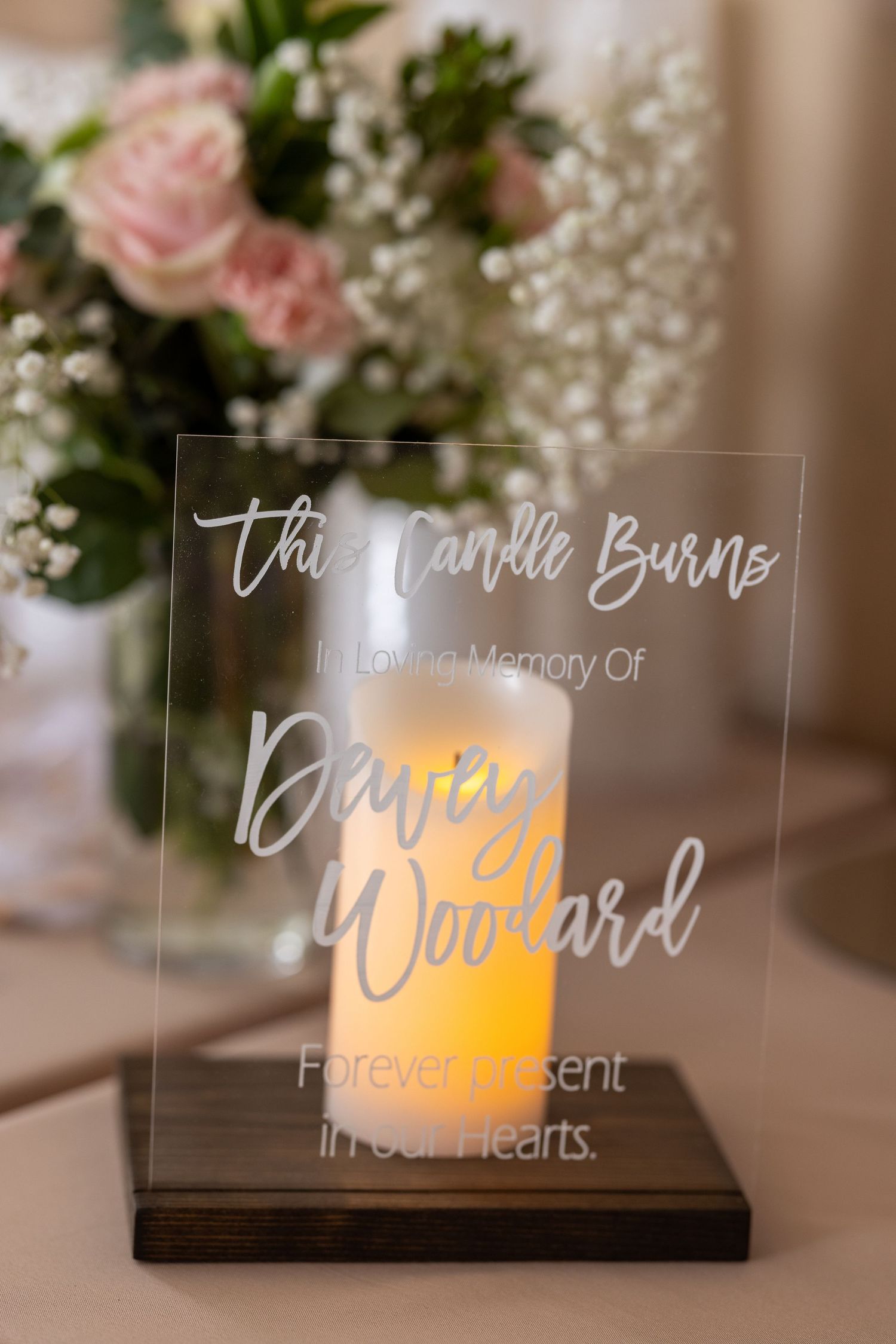 Acrylic memorial candle sign reading This Candle Burns In Loving Memory Of Davey Woodard Forever Present In Our Hearts.