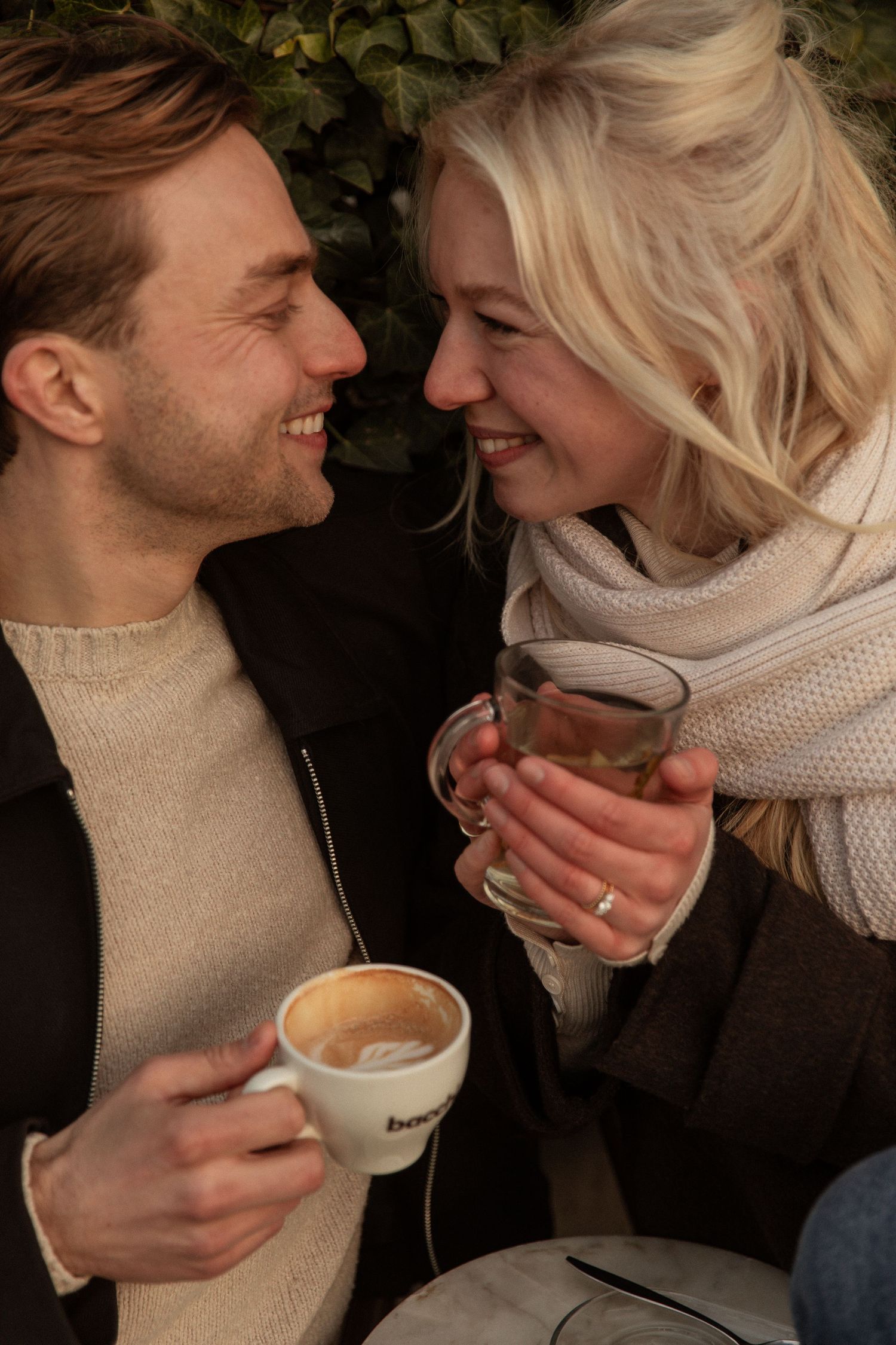 A couple shares intimate moments while enjoying coffee together in a series of candid photographs.