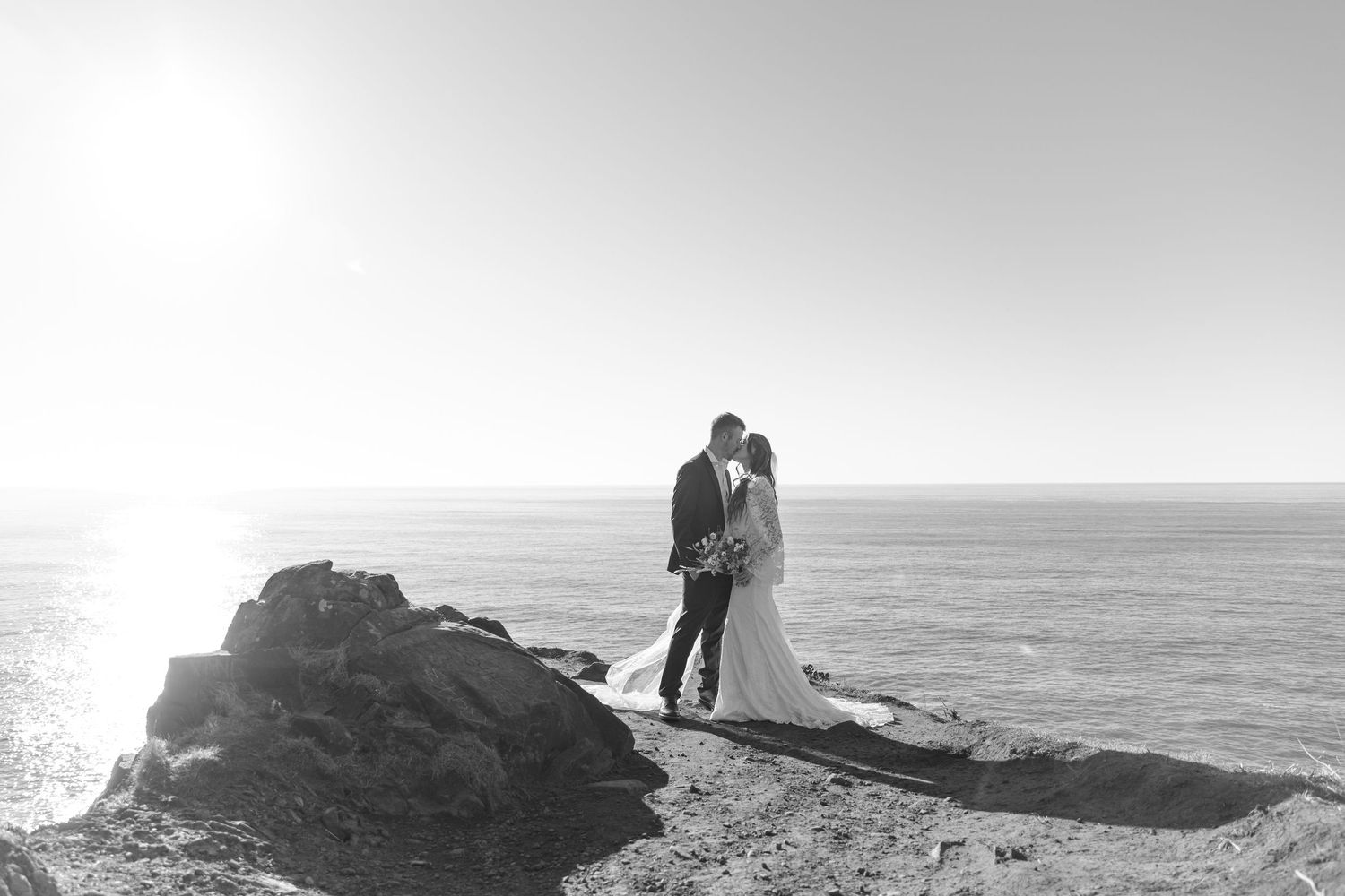A scenic waterfall creates a dramatic backdrop for a romantic photoshoot in nature.
