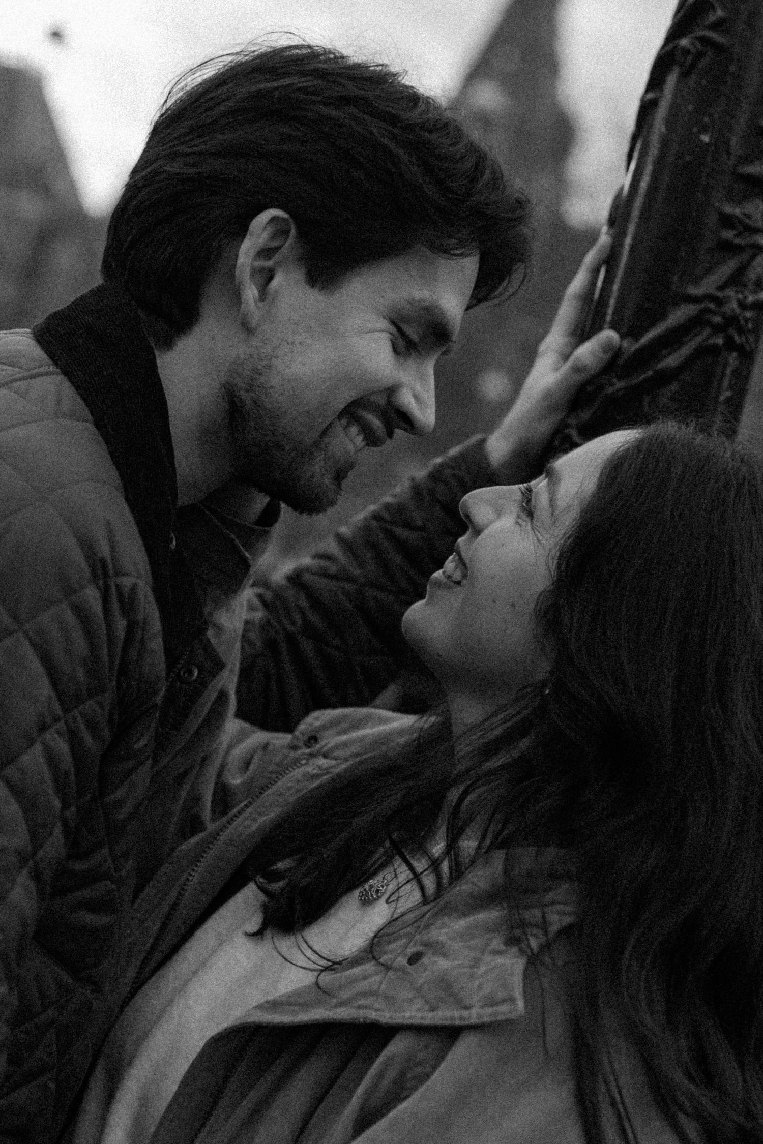 Black and white romantic scene showing a couple in an intimate moment.