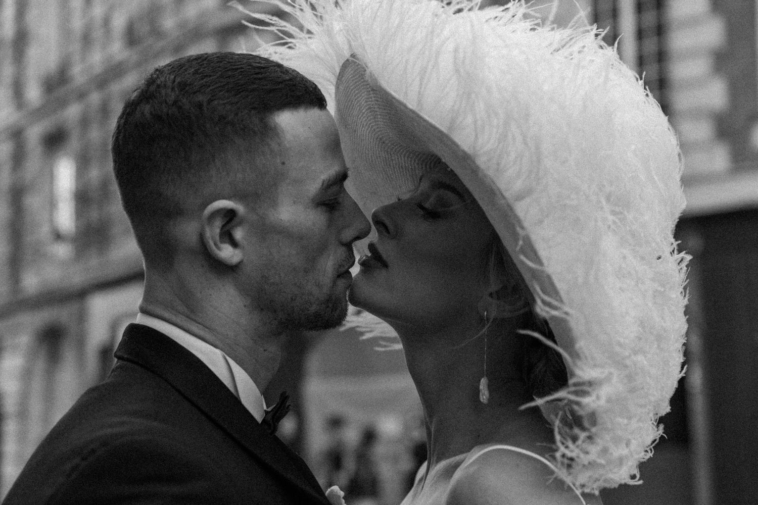 A romantic wedding moment captured in an intimate black and white sequence.