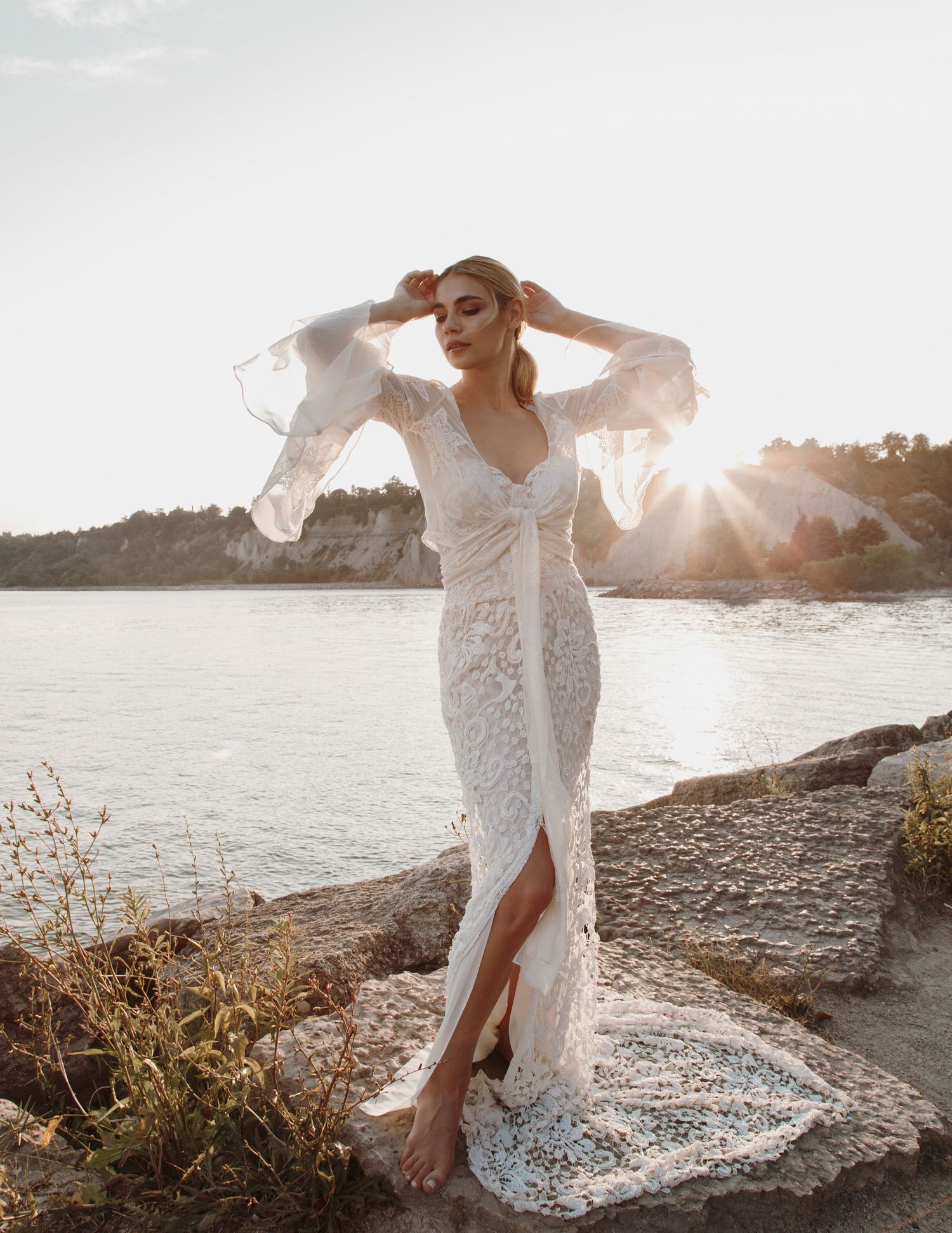 A portrait of a bride on her elopement in Samos, Greece at sunset in a beautiful lace white dress