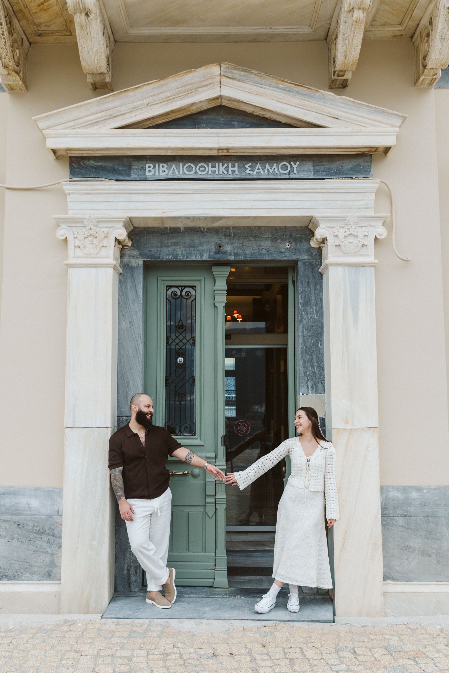 Couple portrait in front of the library in Vathy, Samos, Greece
