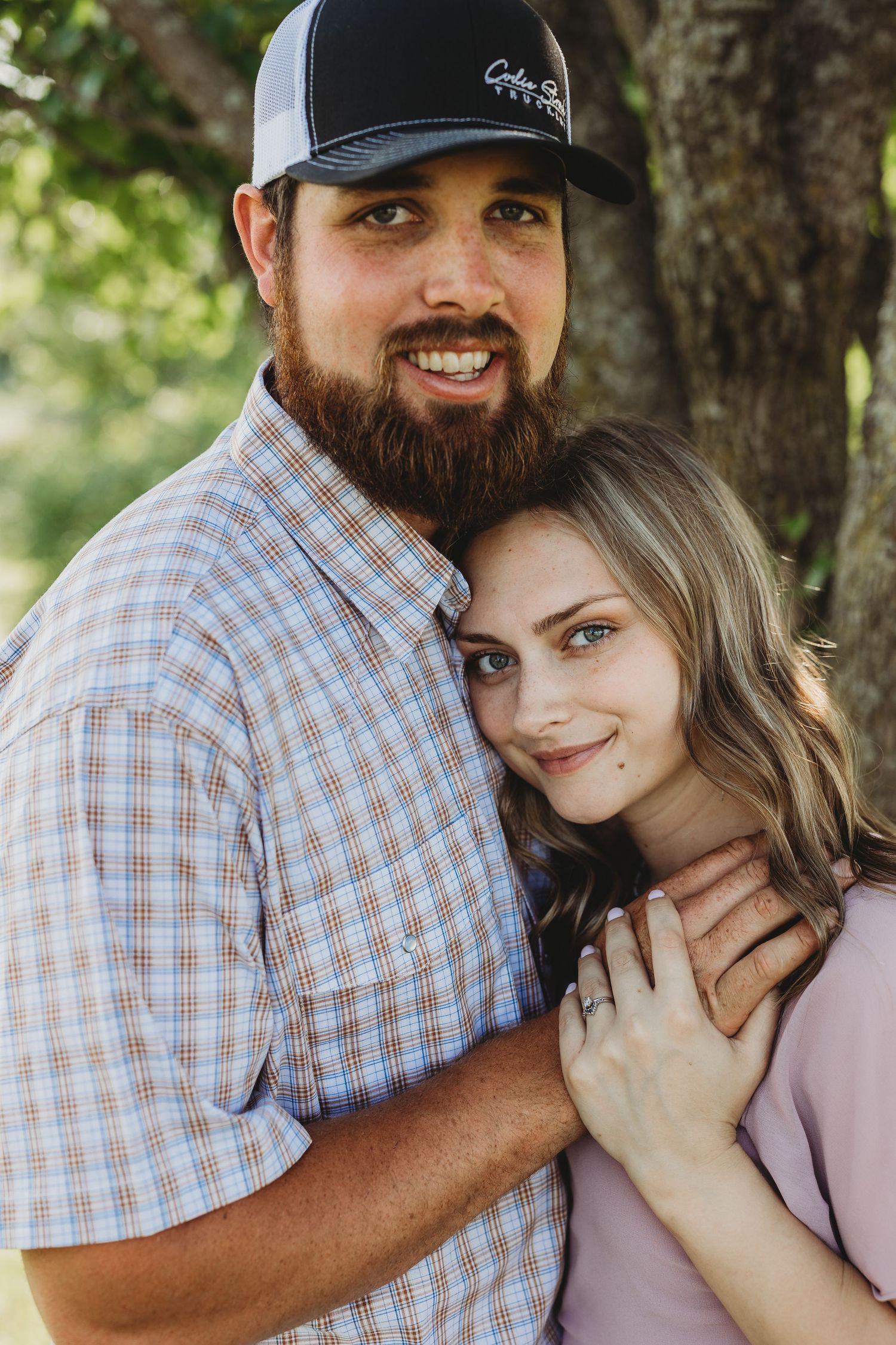 A couple in casual attire sharing intimate moments outdoors in a series of romantic poses.