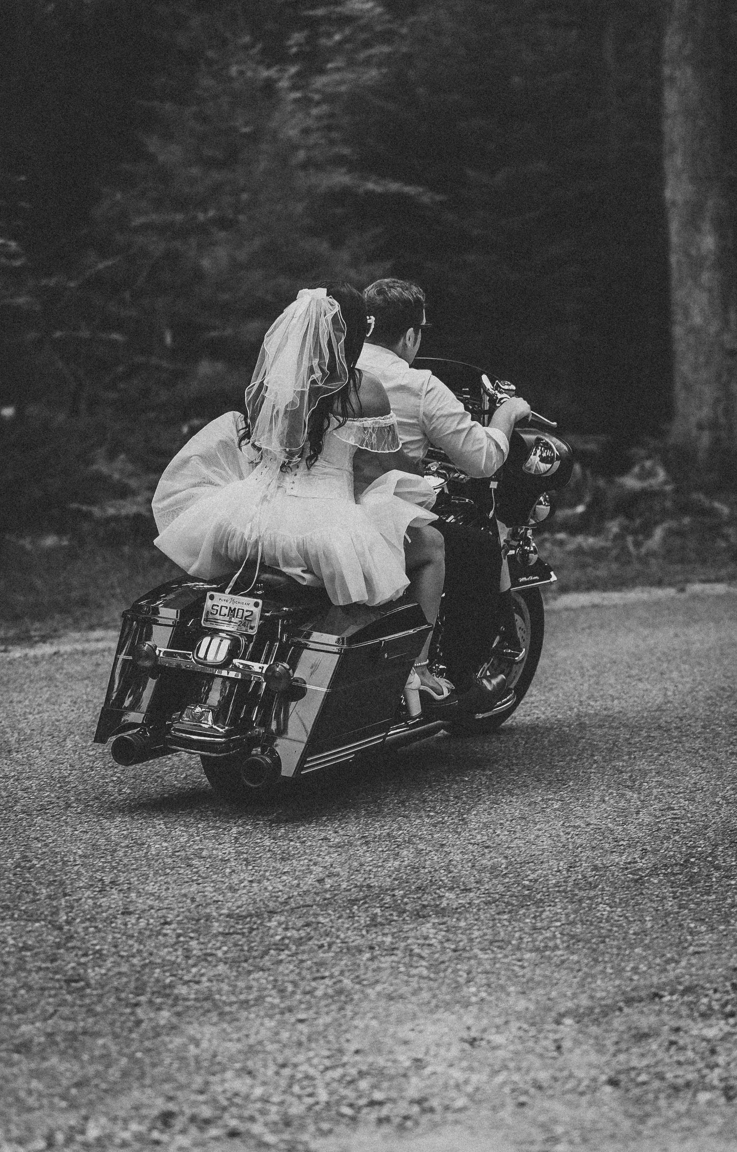 Artistic black and white sequence of a motorcycle photoshoot on gravel road.