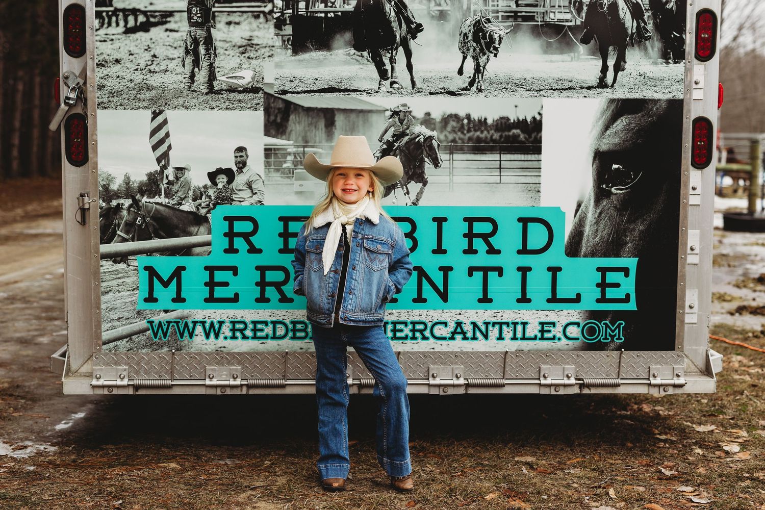 Vintage western storefront with rustic signage and weathered wooden exterior displaying merchandise.