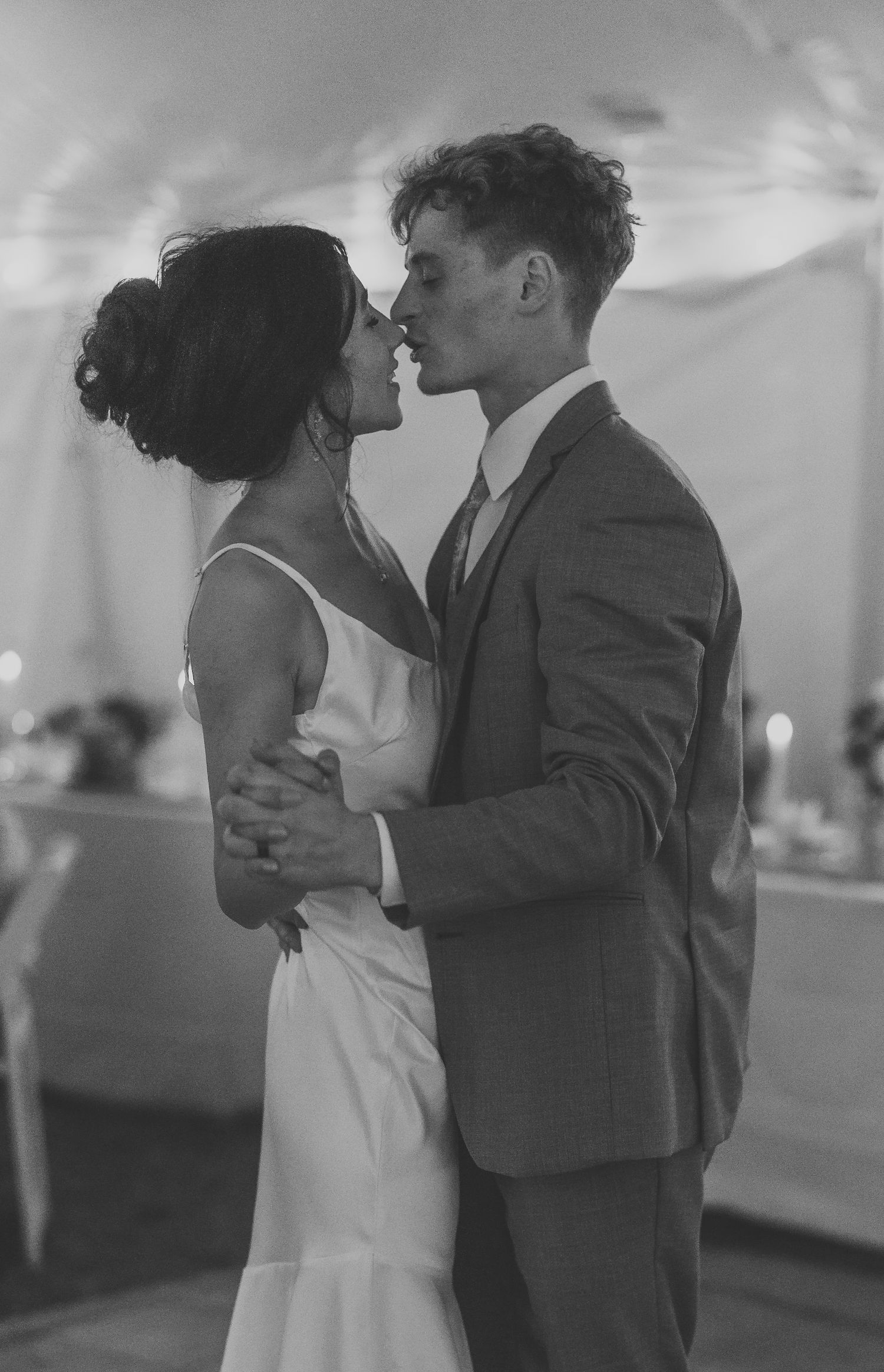 Romantic black and white photo of couple sharing an intimate dance moment.