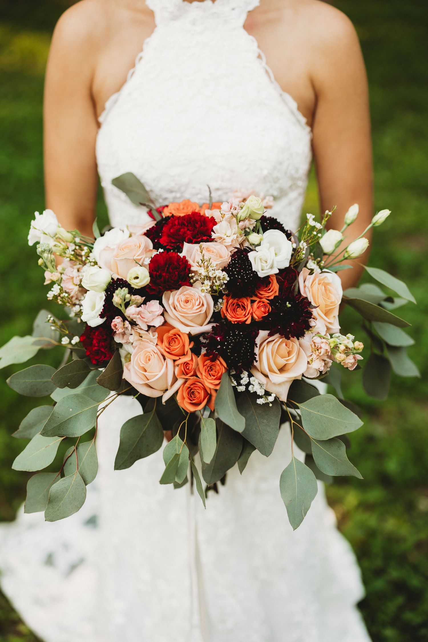 Close-up shots of a bridal bouquet with peach and burgundy roses, white flowers, and eucalyptus leaves.