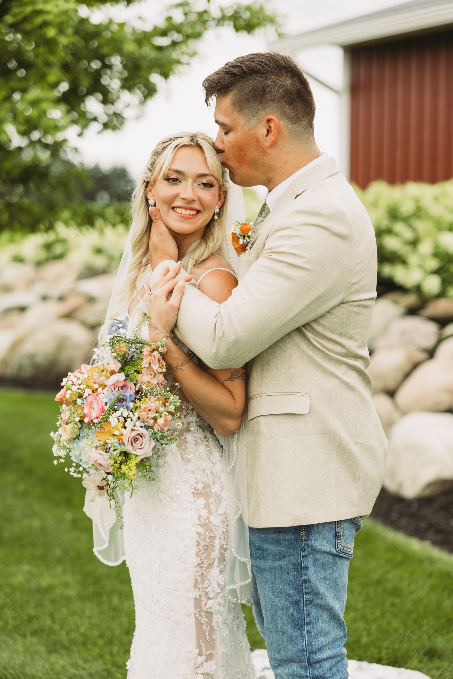 Romantic wedding portraits captured outdoors with floral bouquet and natural scenery.