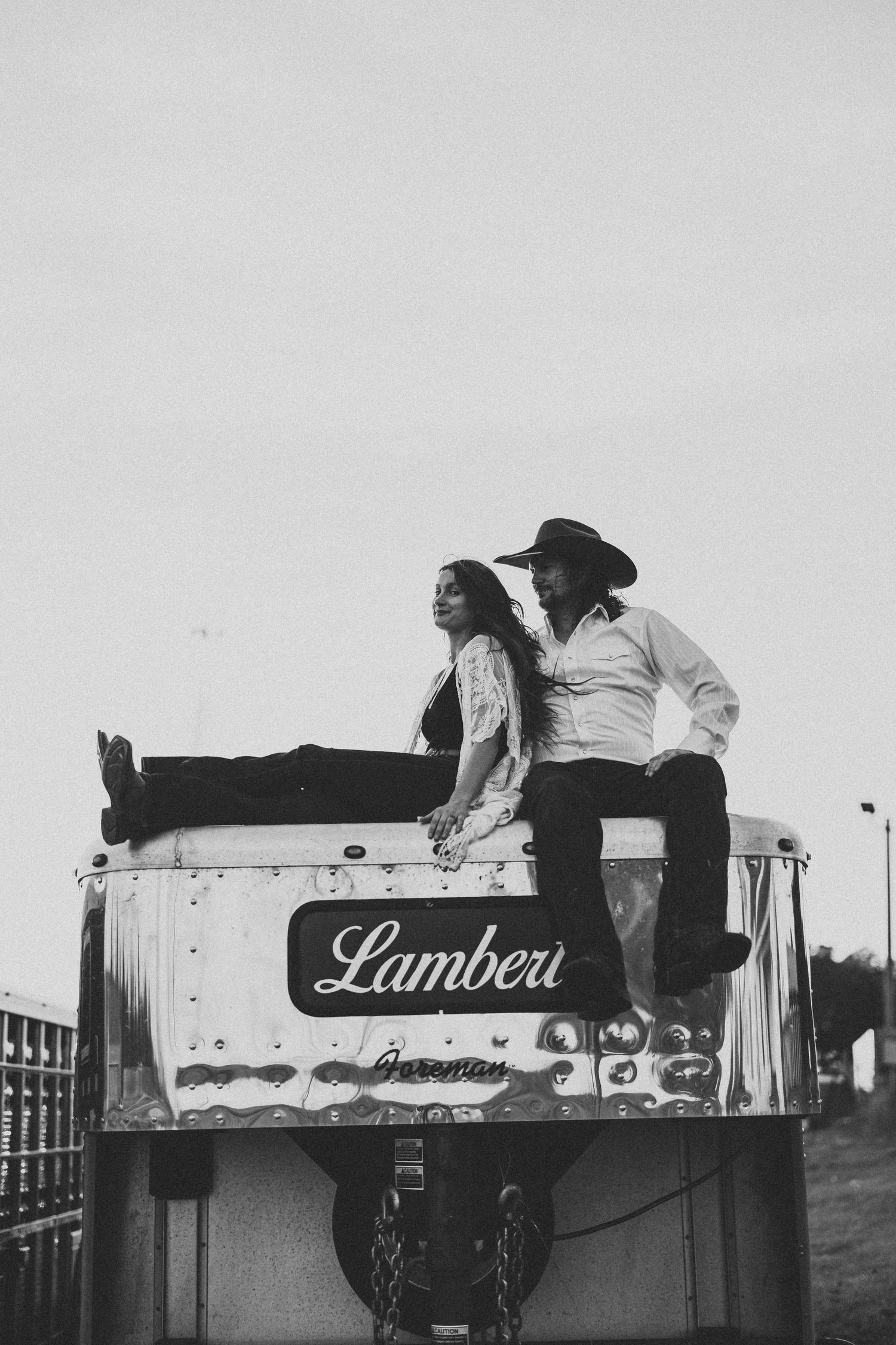 Vintage black and white photo series showing people lying on top of a delivery truck labeled 'Lambea'.