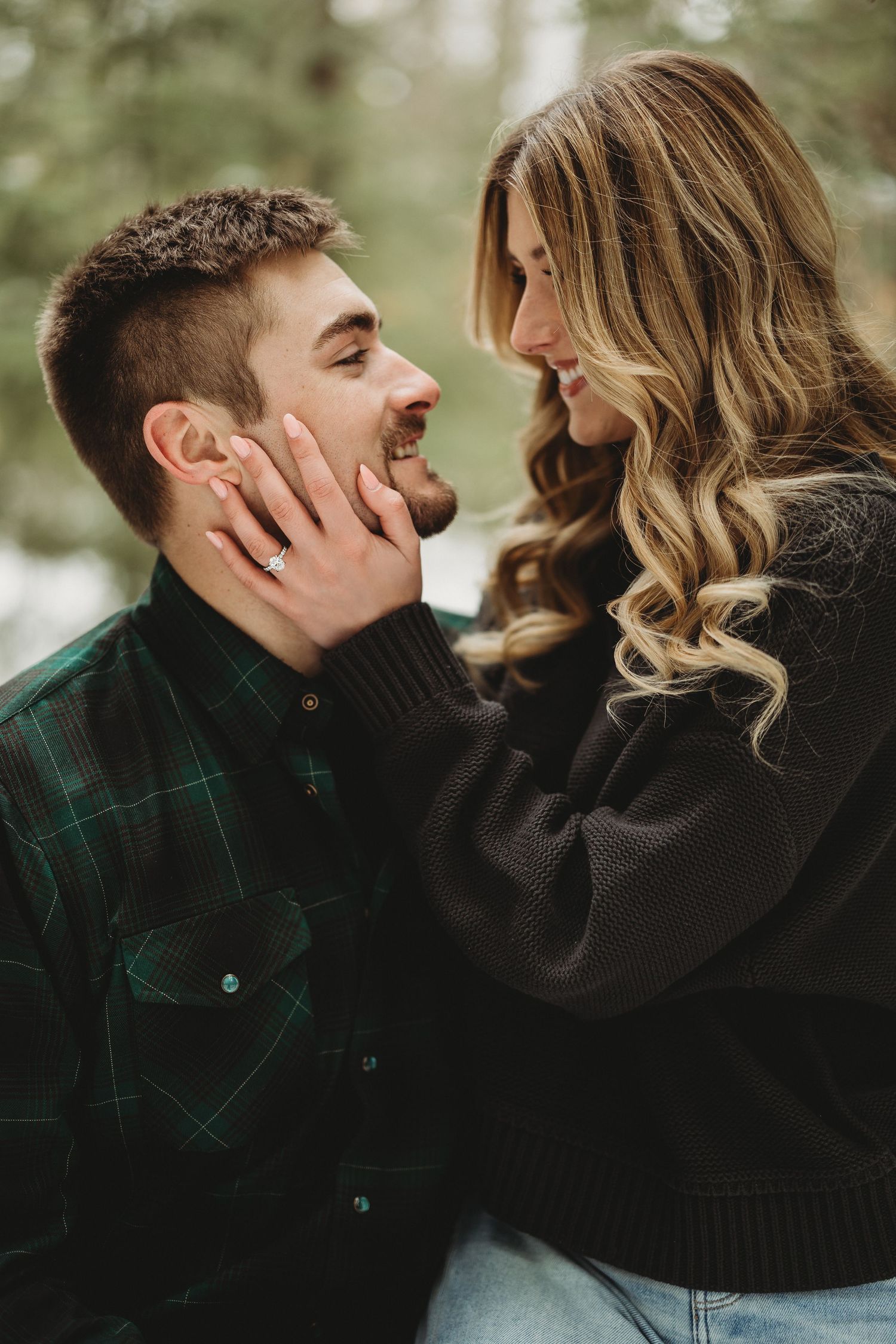 A romantic couple embraces outdoors wearing green and black clothing in a series of intimate portrait shots.