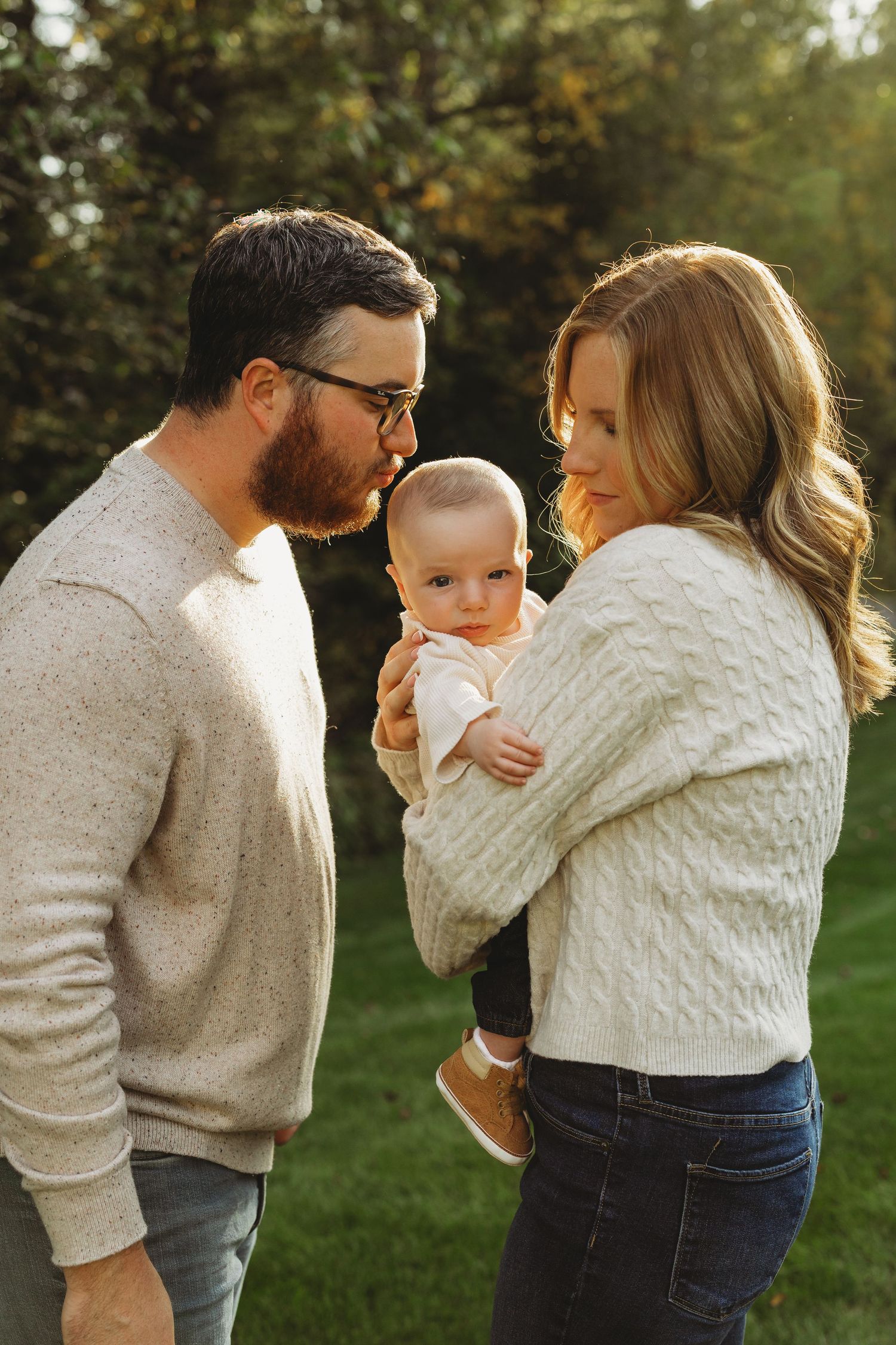 Candid outdoor photoshoot showing playful interactions on a sunny autumn day.