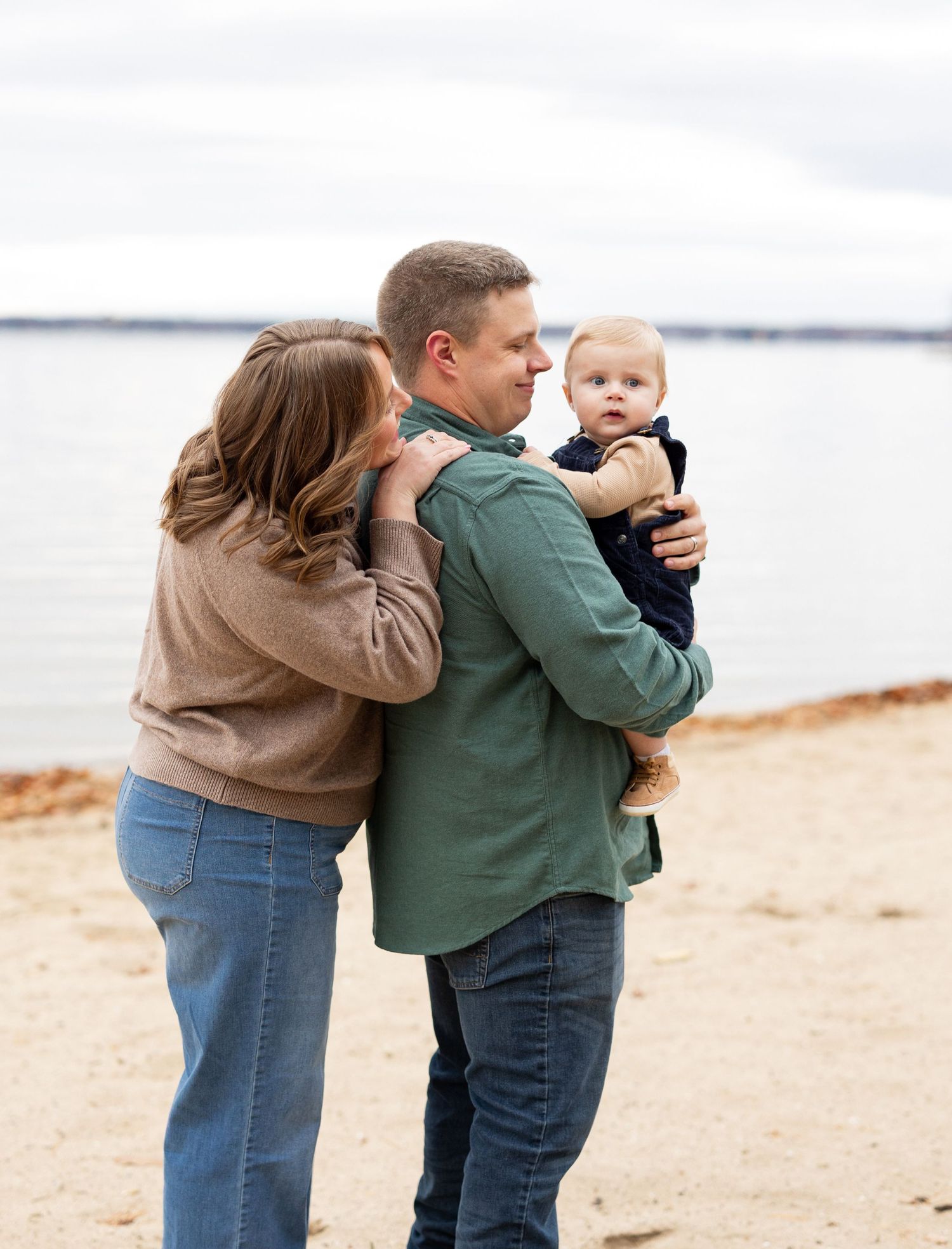 Series of tender moments captured on a cloudy day at the beach.
