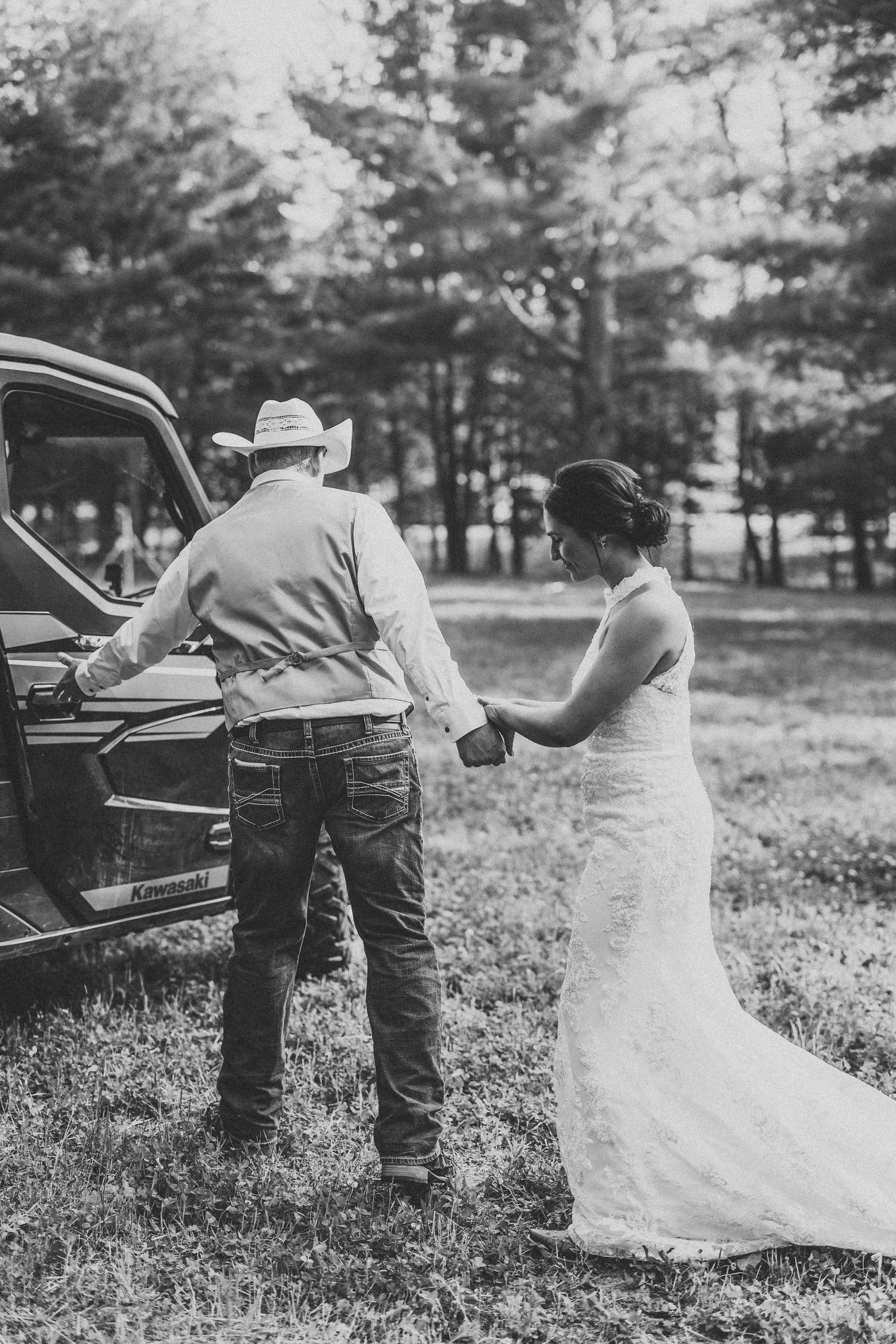 A sequence of black and white photos showing a couple in wedding attire posing near a vintage car in a rural setting.