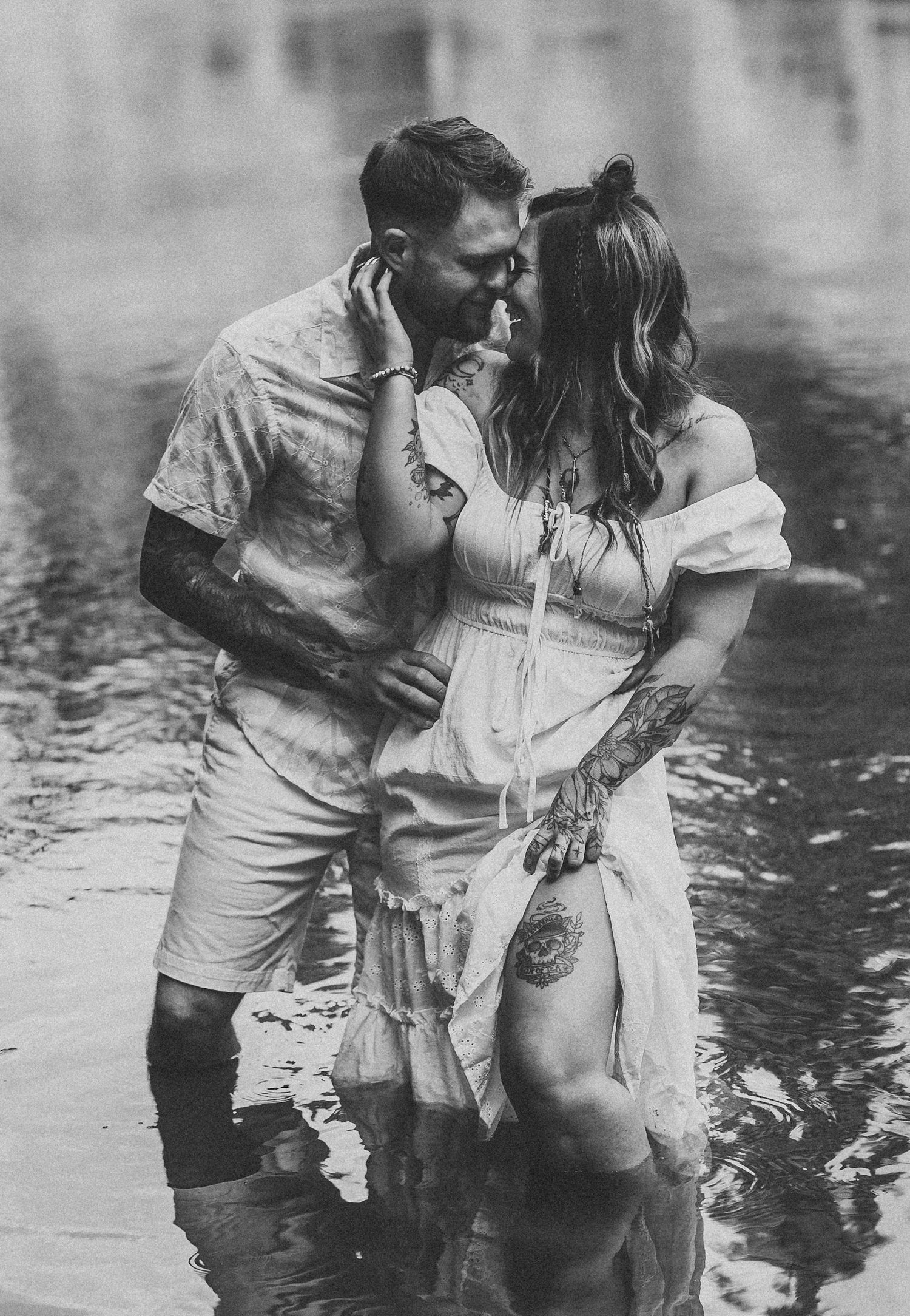 A sequence of vintage black and white photographs showing a couple embracing in shallow water.