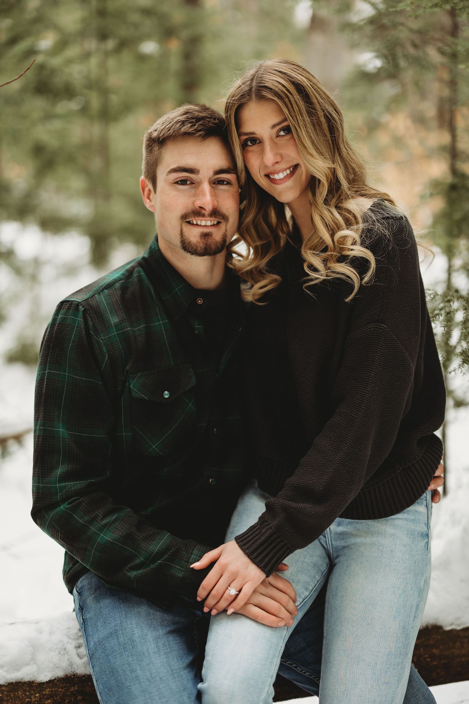 Winter engagement photo series showing couple in coordinated outfits among snowy pine trees.