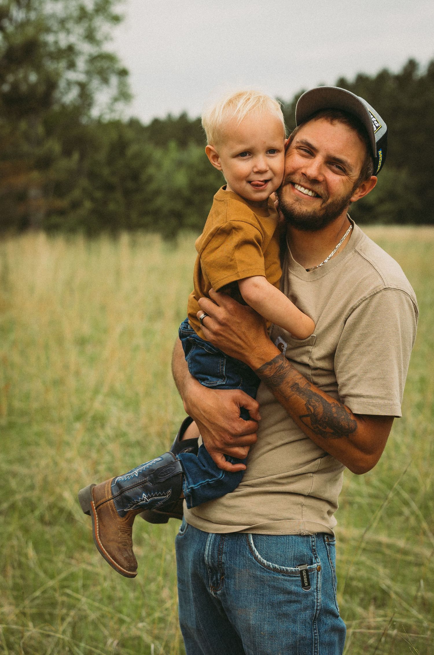 Sweet candid moments between parent and child playing in a sunny meadow.
