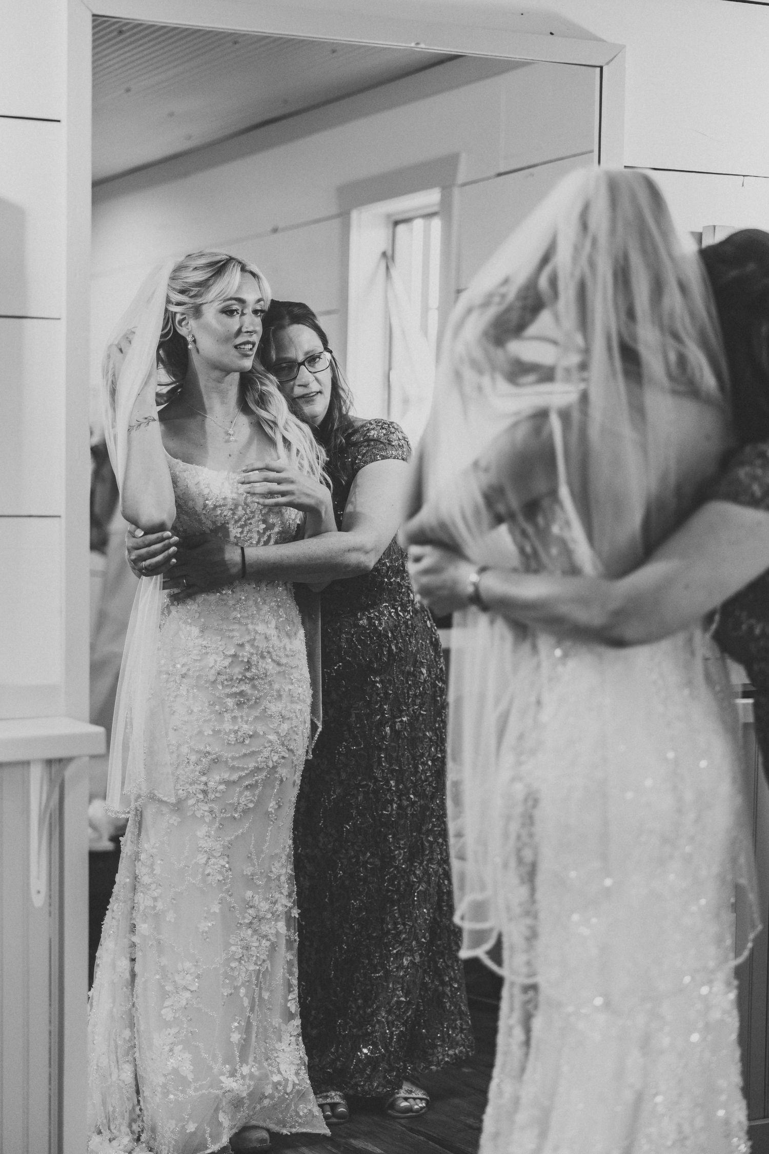 A sequence of black and white photos showing a couple dancing together in an indoor space.