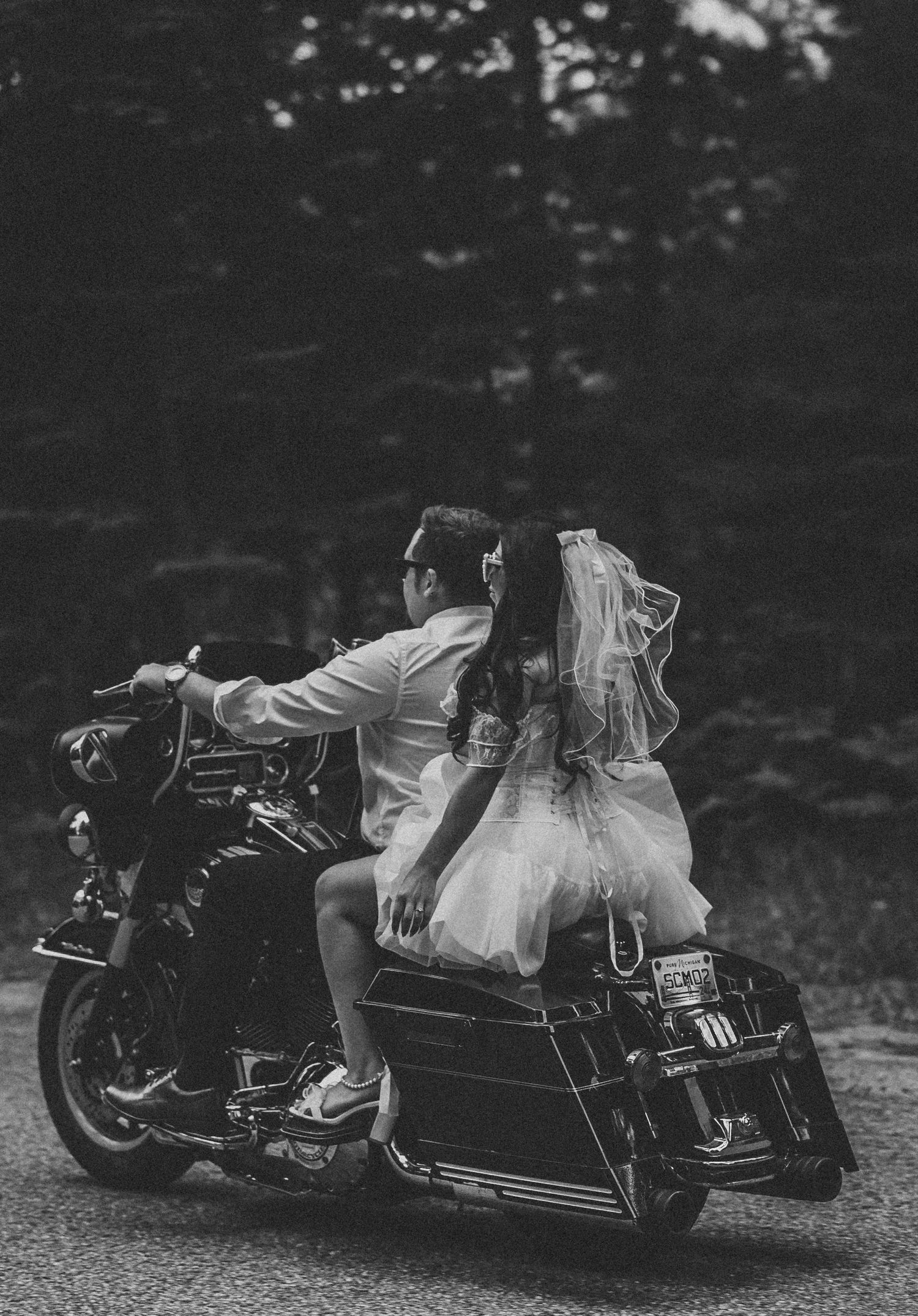 Black and white motorcycle photography series with dramatic lighting and poses.